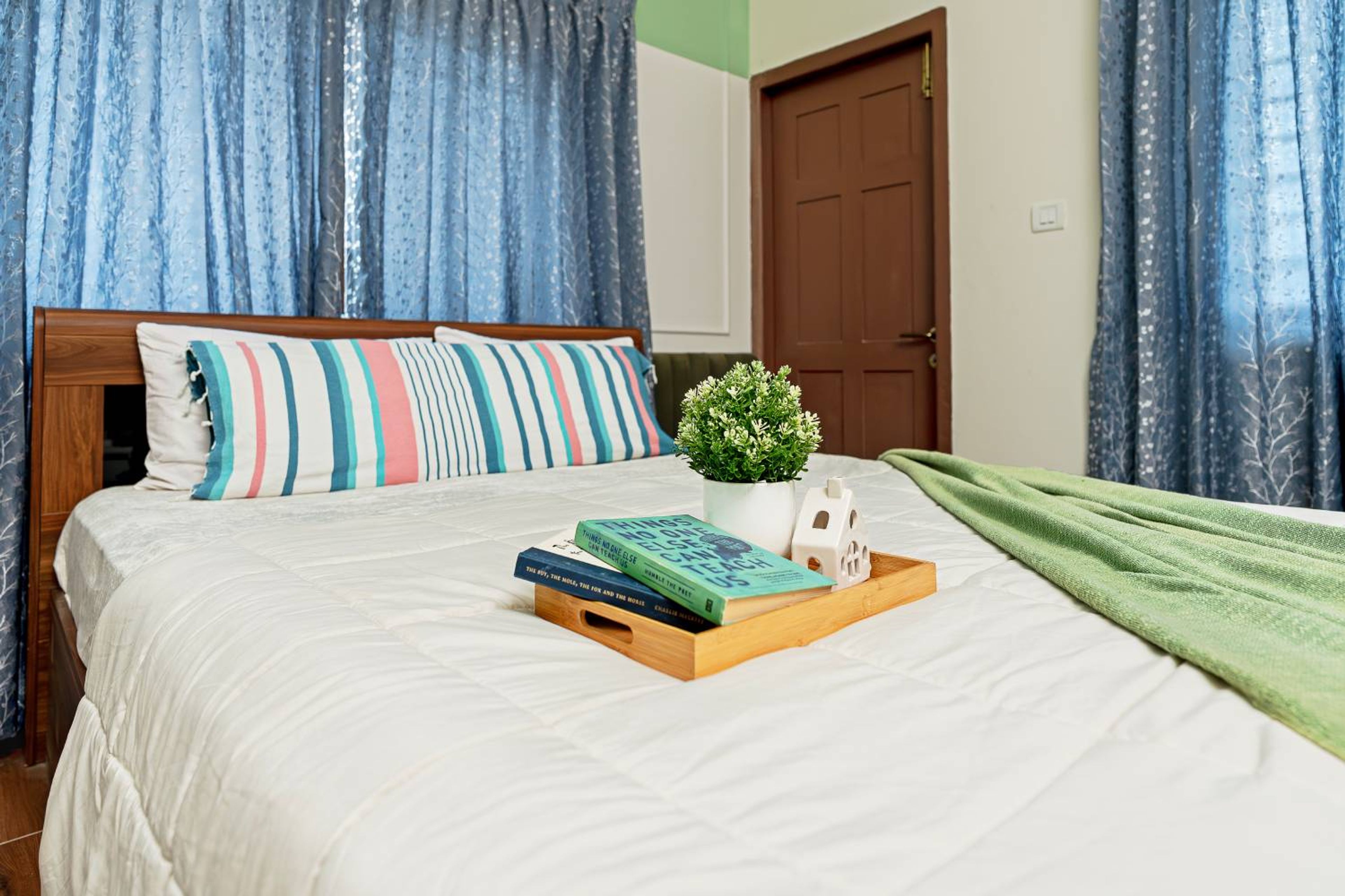 Bedroom Design with Wooden Bed and Blue Curtains