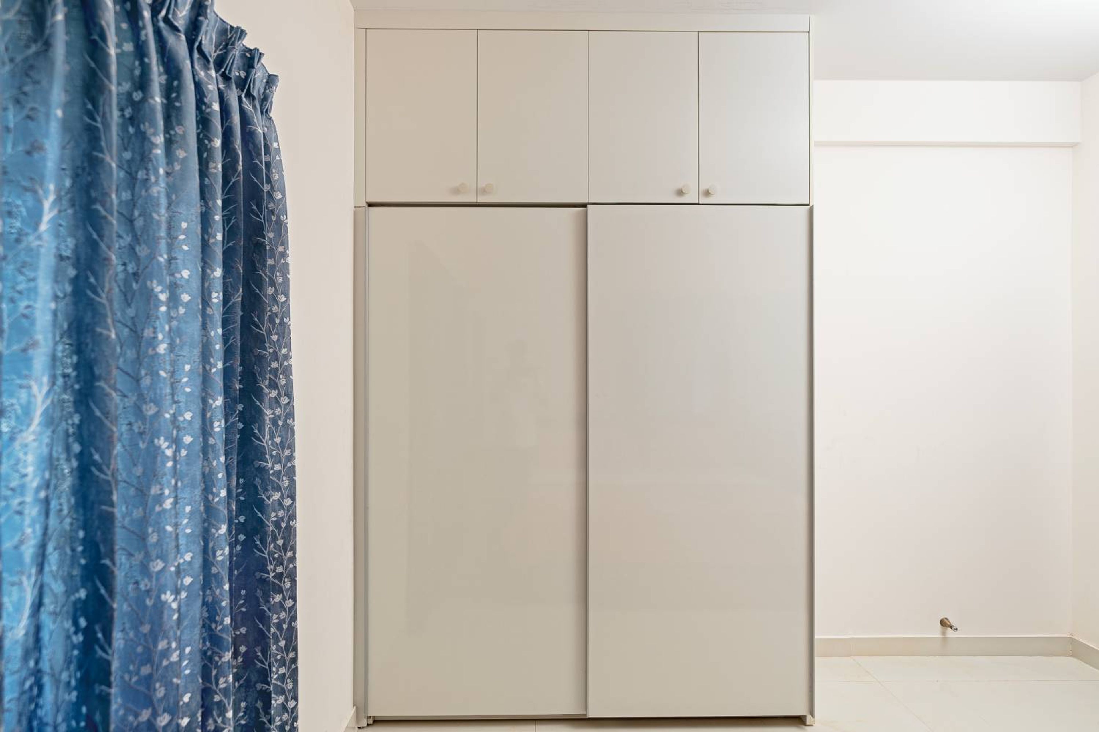 2-Door Off-White Sliding Wardrobe Design with Loft Unit