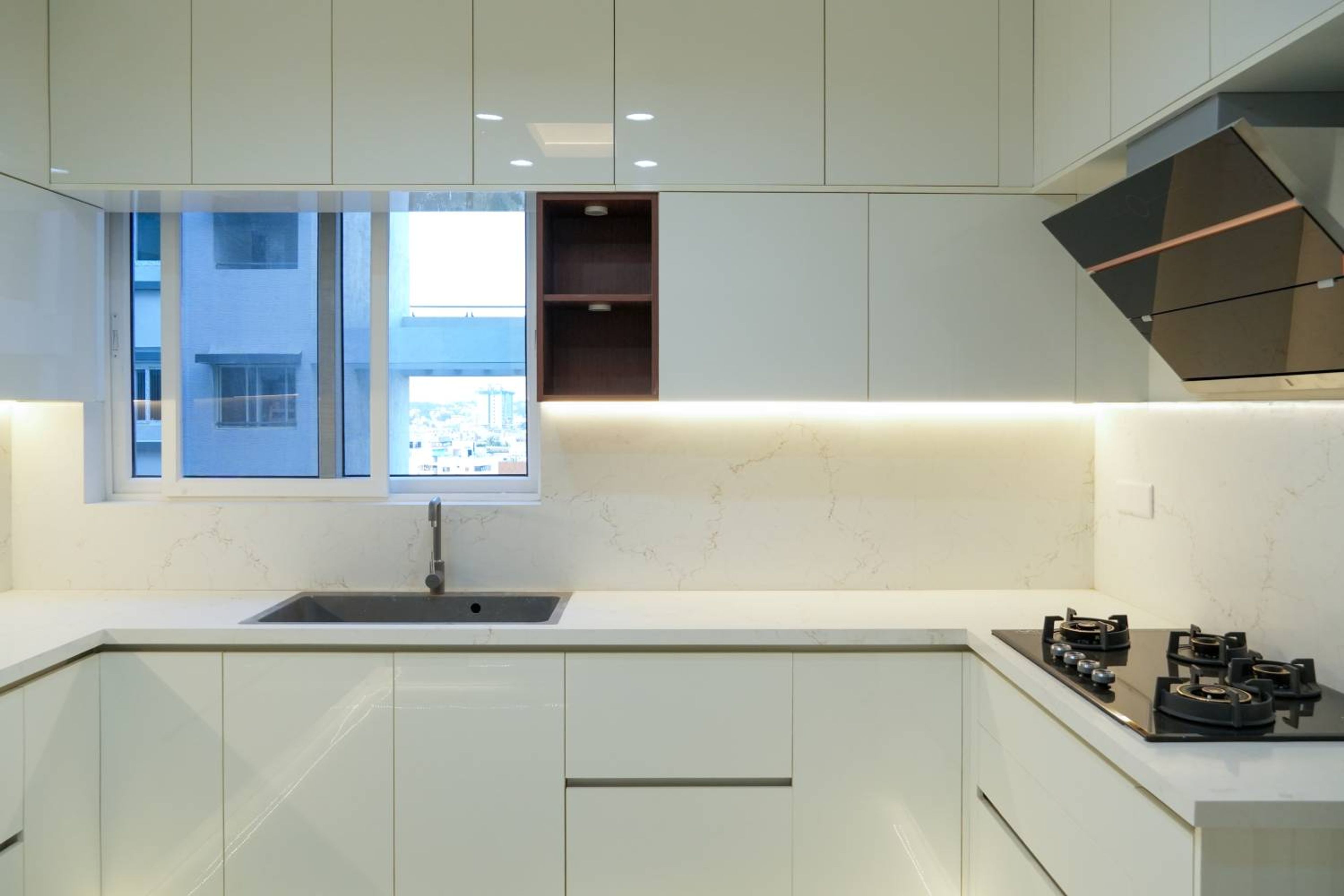 U Shaped Kitchen Design with White Glossy Cabinets and Quartz Countertop