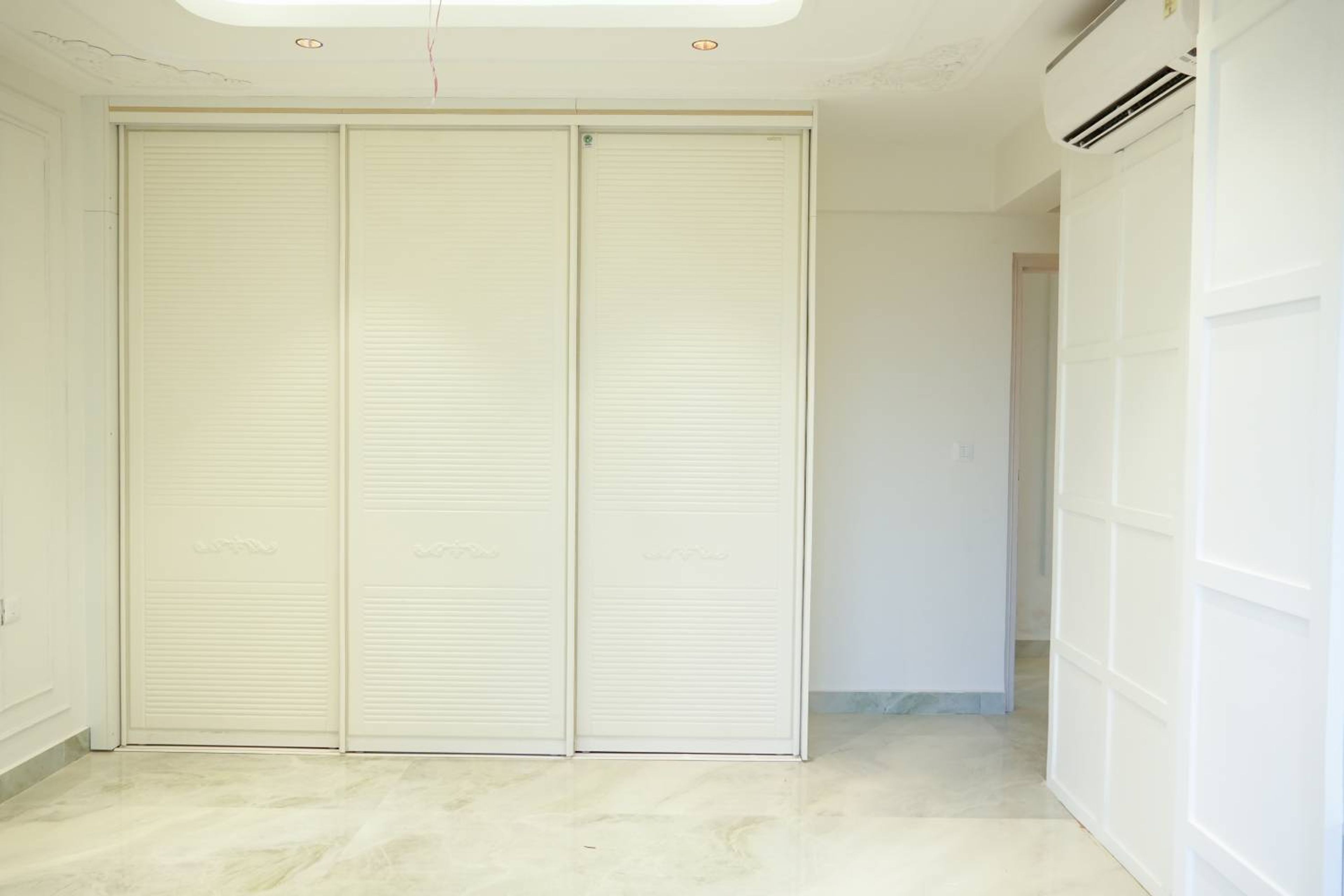 Modern Sliding Wardrobe Design with Duco Finish and Louvered Panels