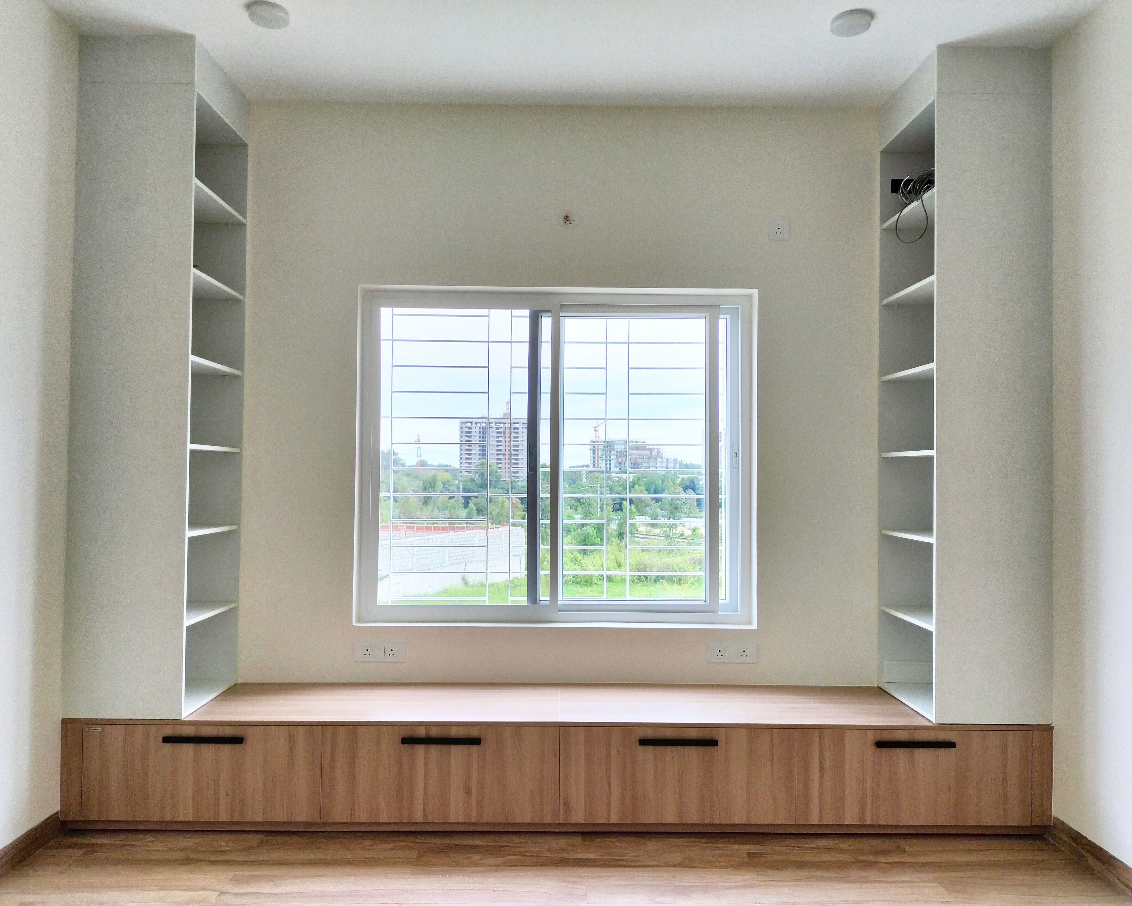 Room Design with Wooden Seating Storage with Two White Open Tall Units