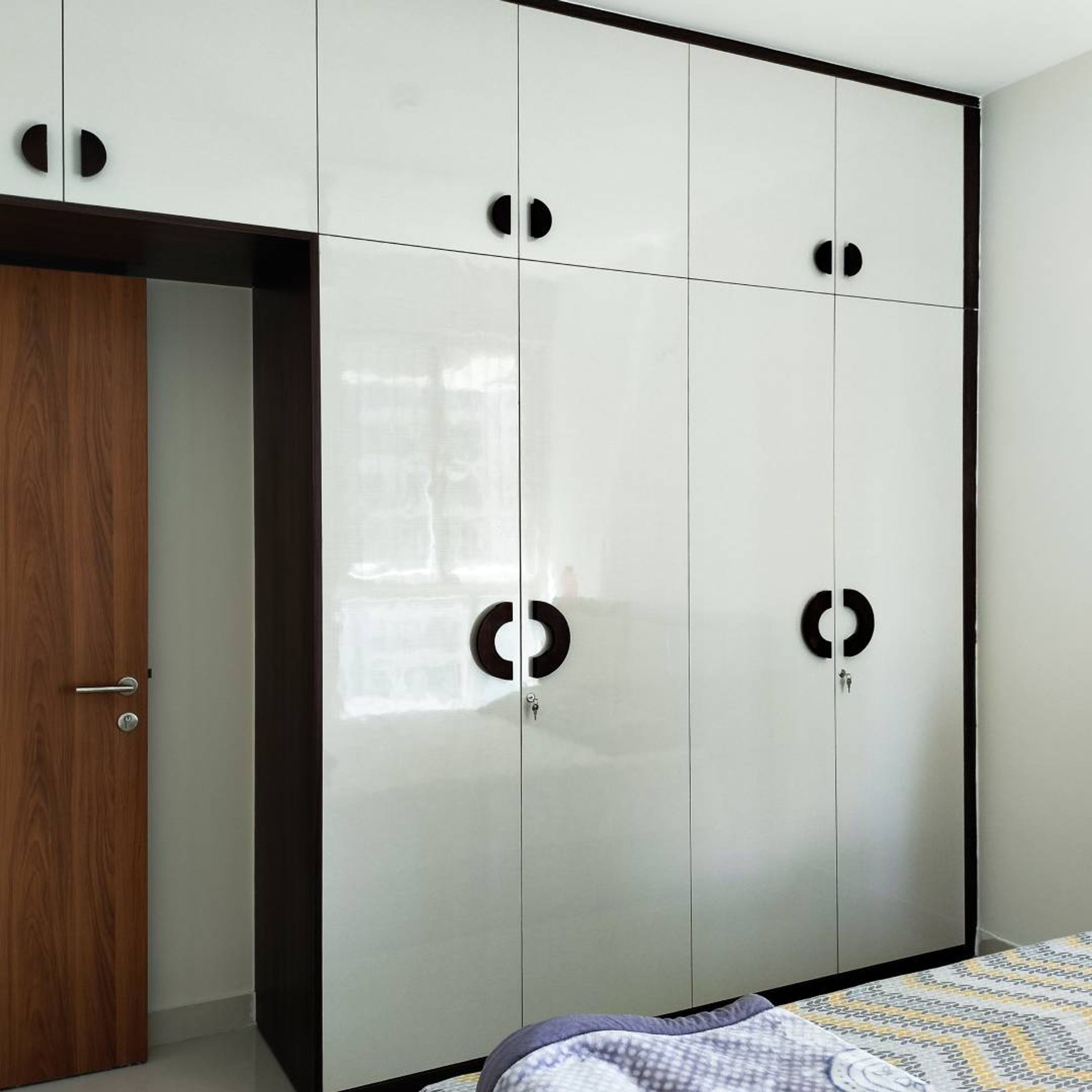Modern Bedroom Swing Wardrobe Design with Glossy White Panels