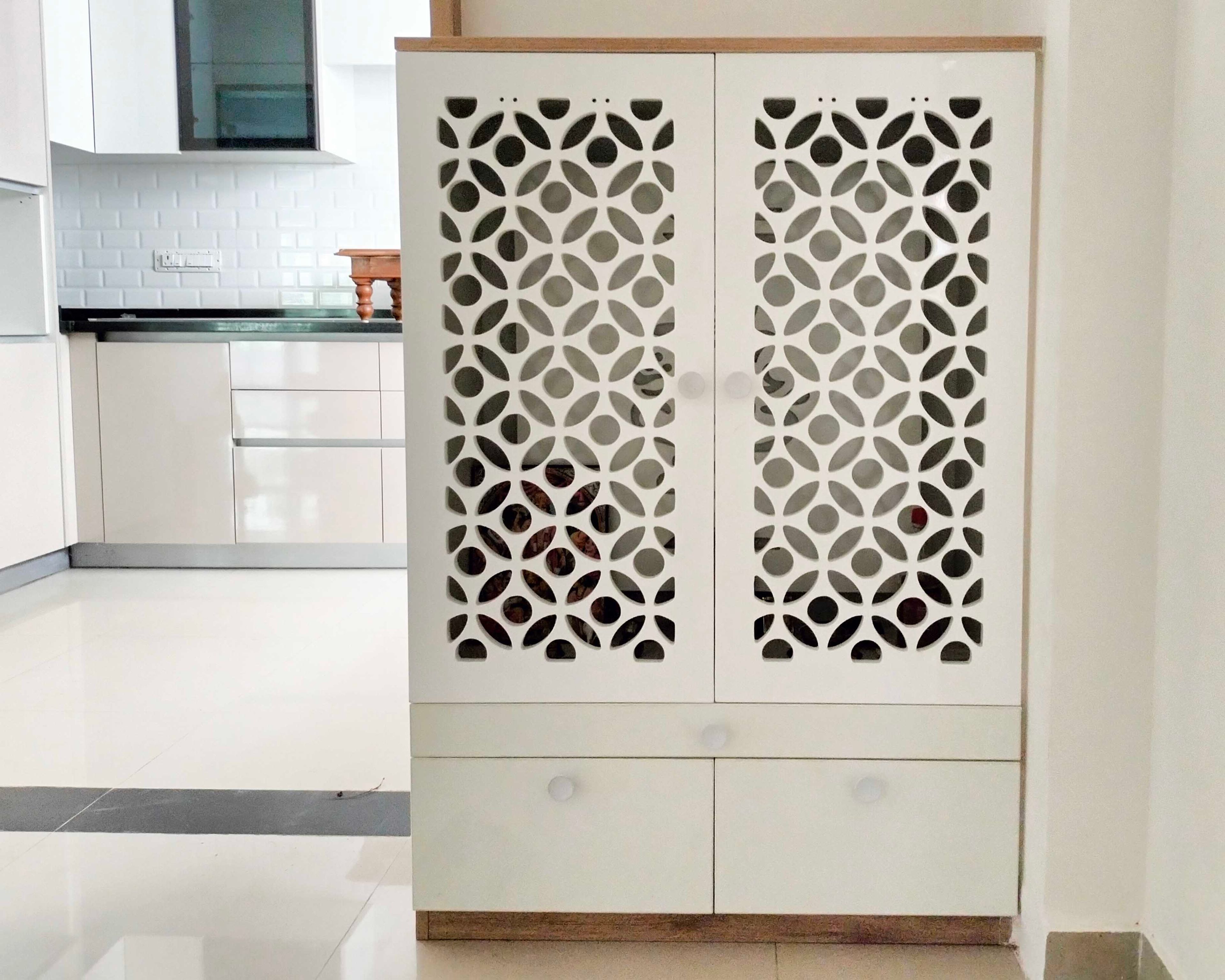 Pooja Unit Design with White Latticework Door