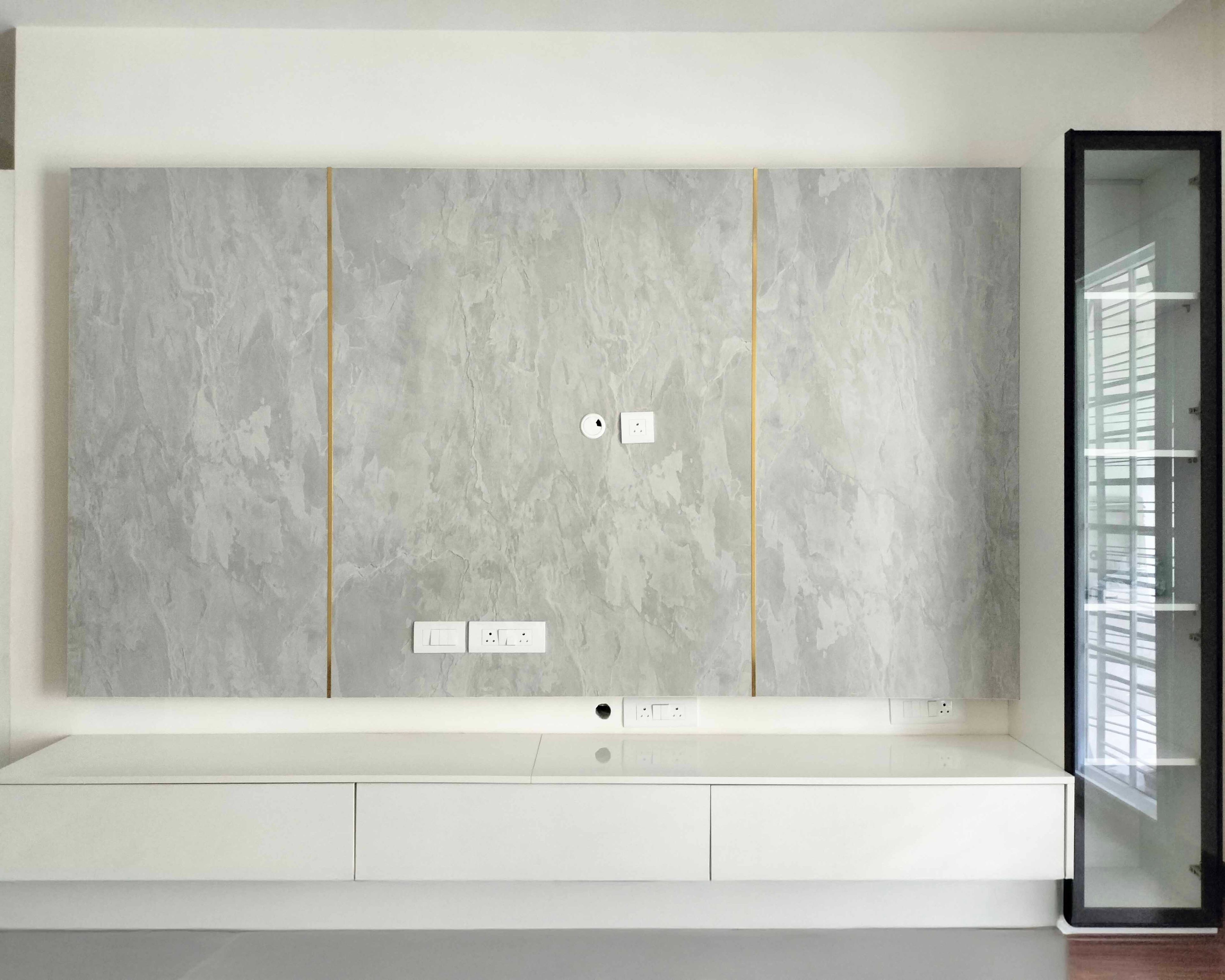 TV Unit Design with Marble Patterned Backsplash with Gold Inlays