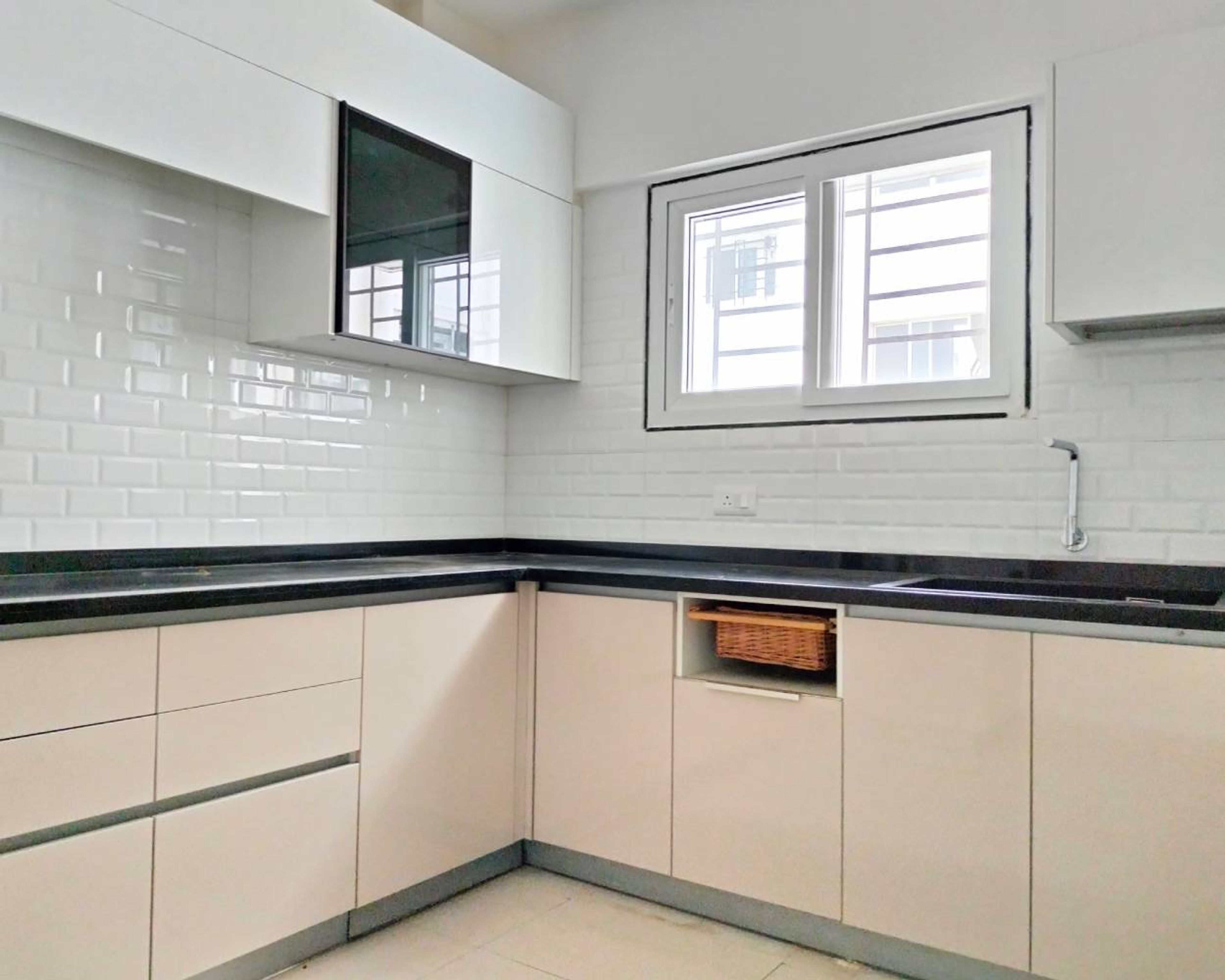 U-Shaped Kitchen Design with White Brick Patterned Backsplash