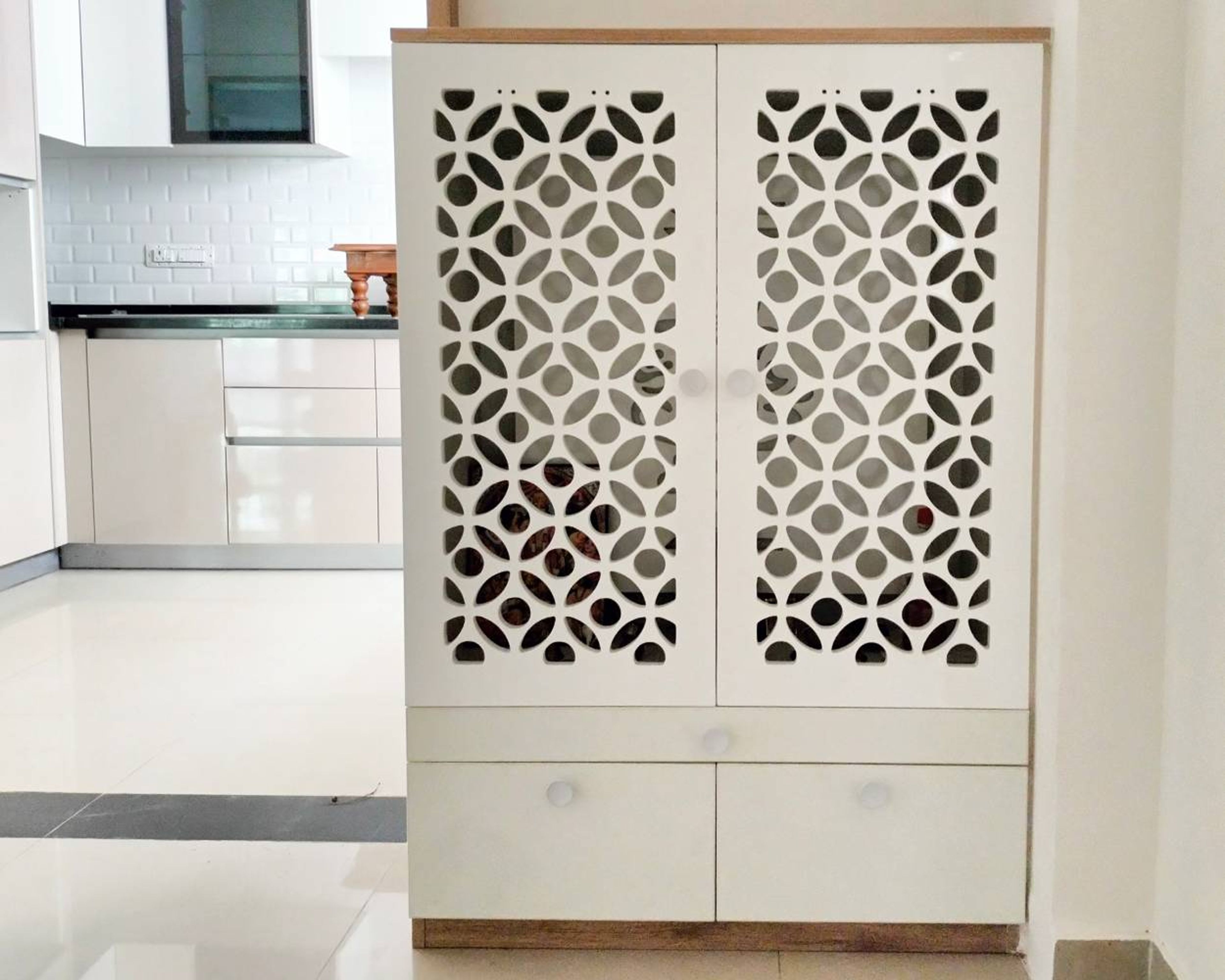 White Pooja Unit Design with CNC Cut and Drawers