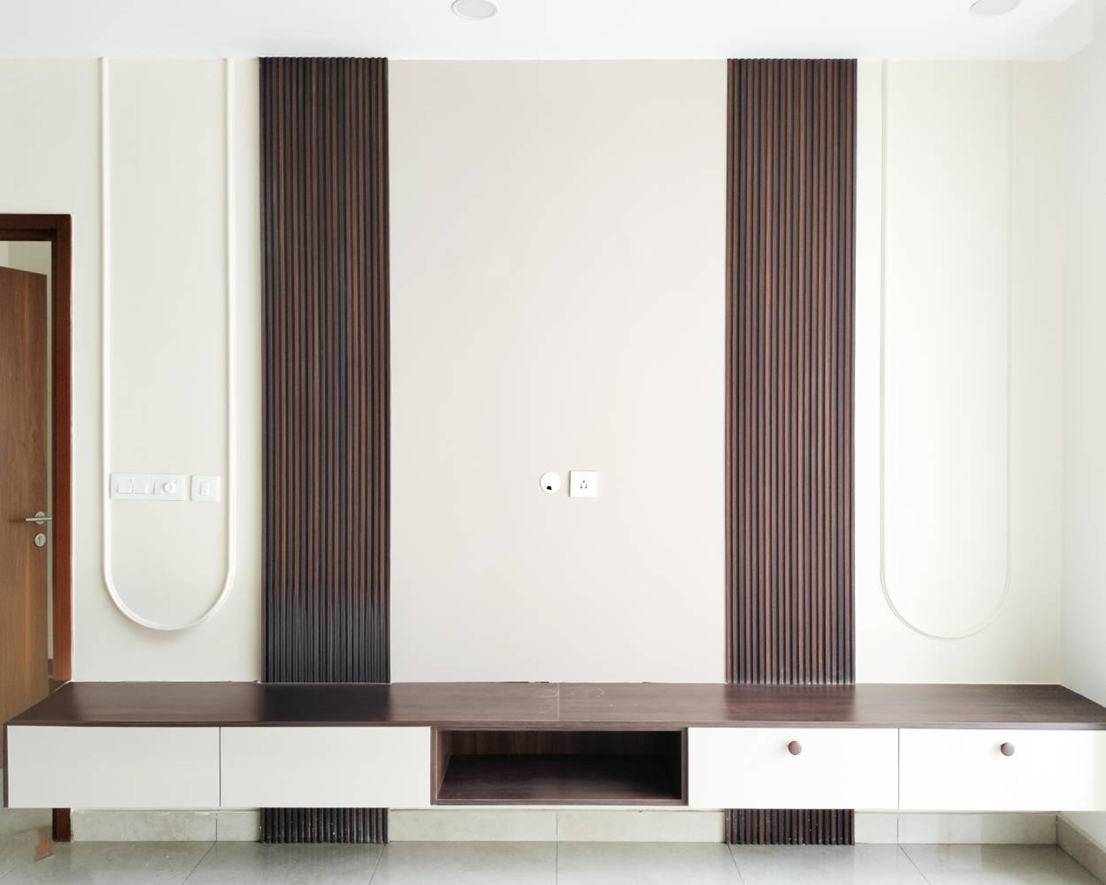 TV Unit Design with Cream Wall Trims and Wooden Slatted Panels