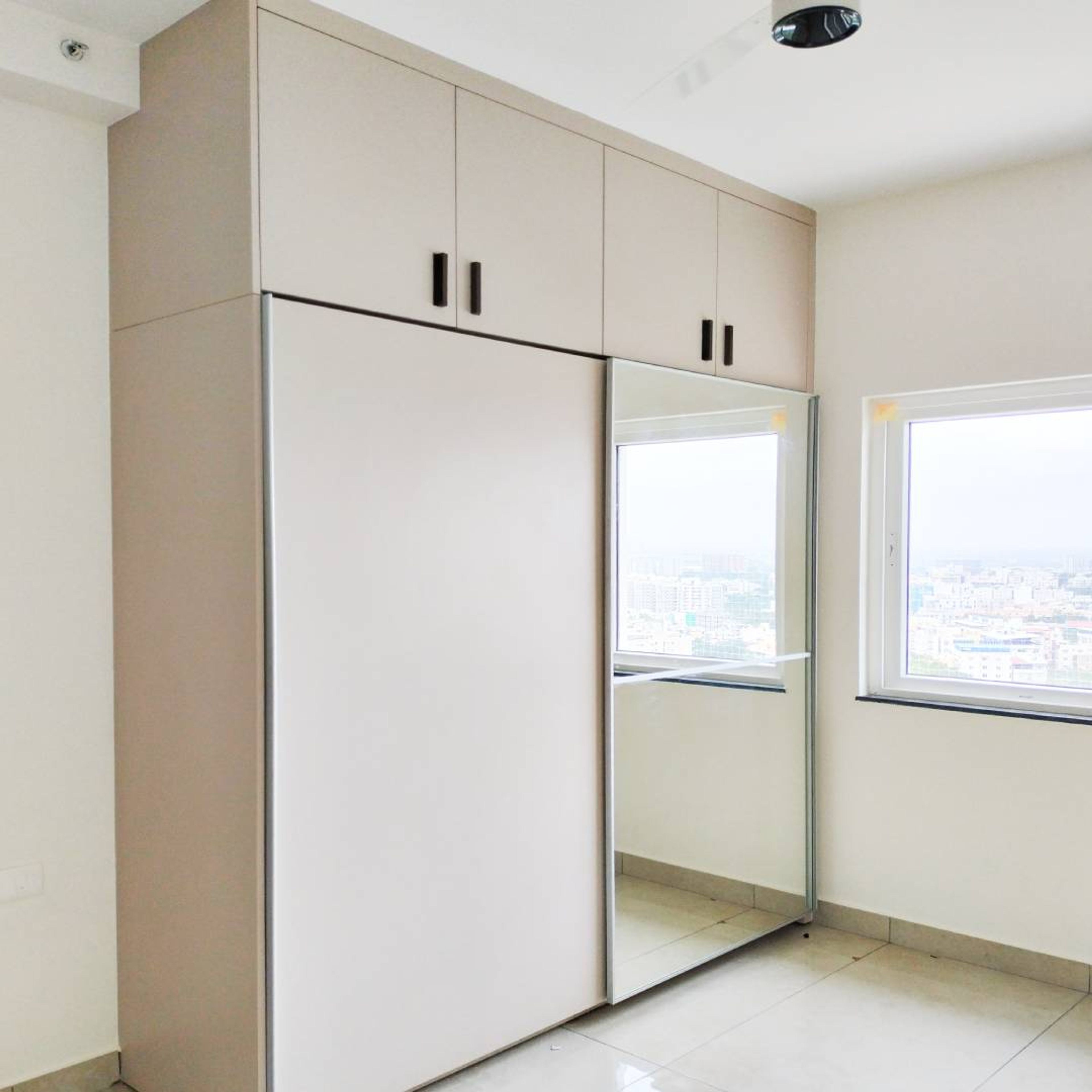 2-Door Beige Sliding Wardrobe Design with Integrated Mirror