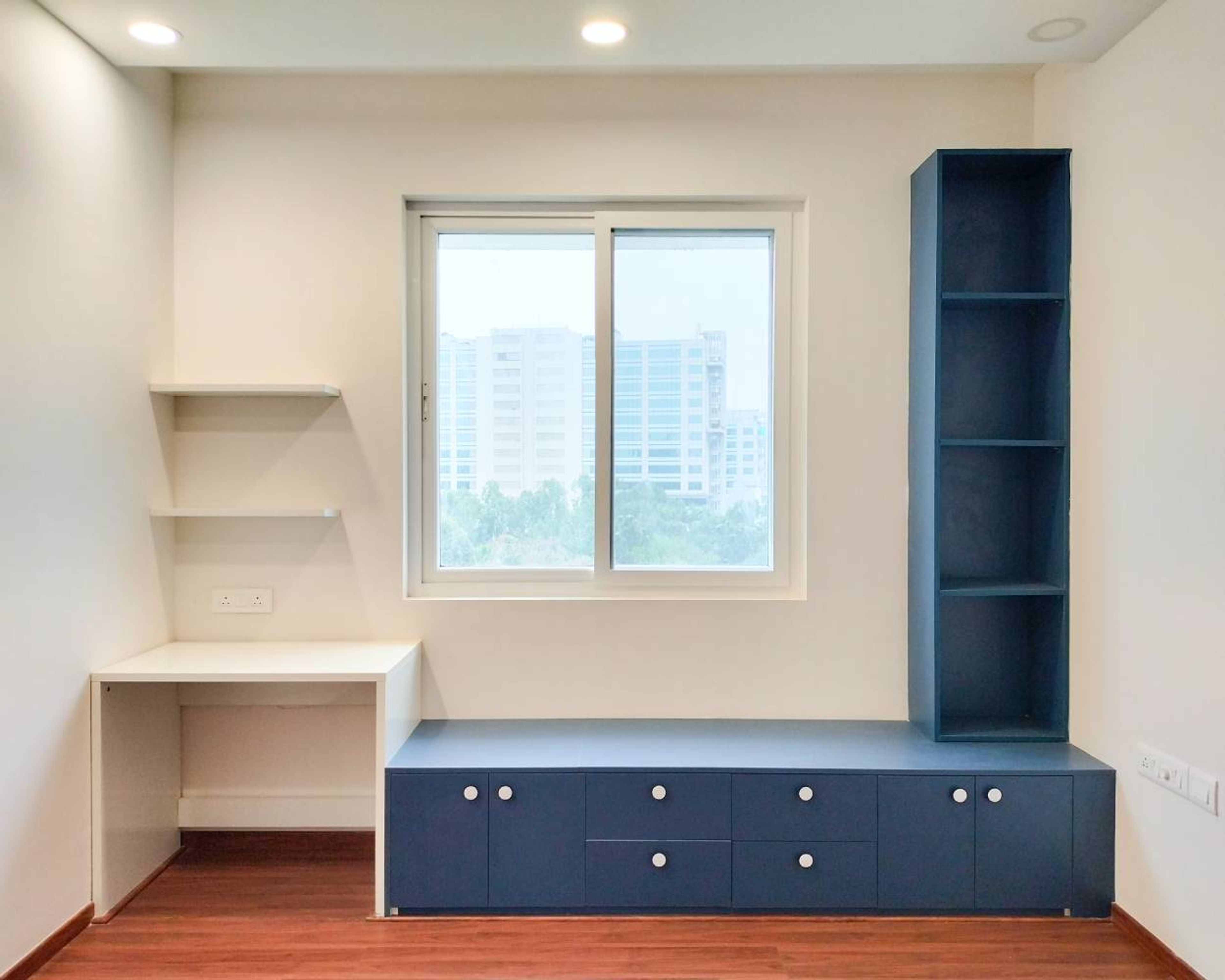 White Study Unit with Blue Seating Storage and Blue Open Shelf Tall Unit