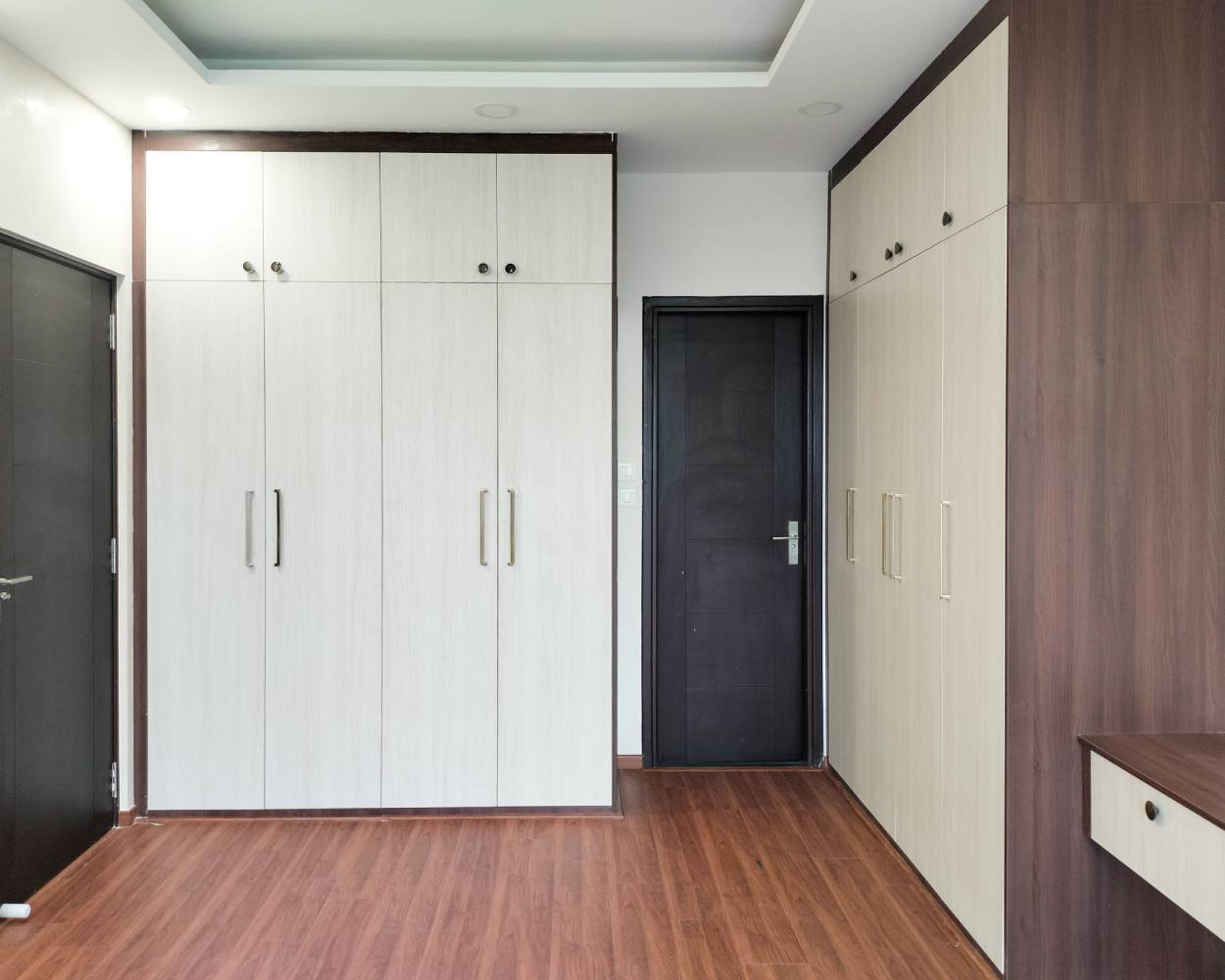 6-Door Swing Wardrobe Design with Tall Cabinets and Mirror
