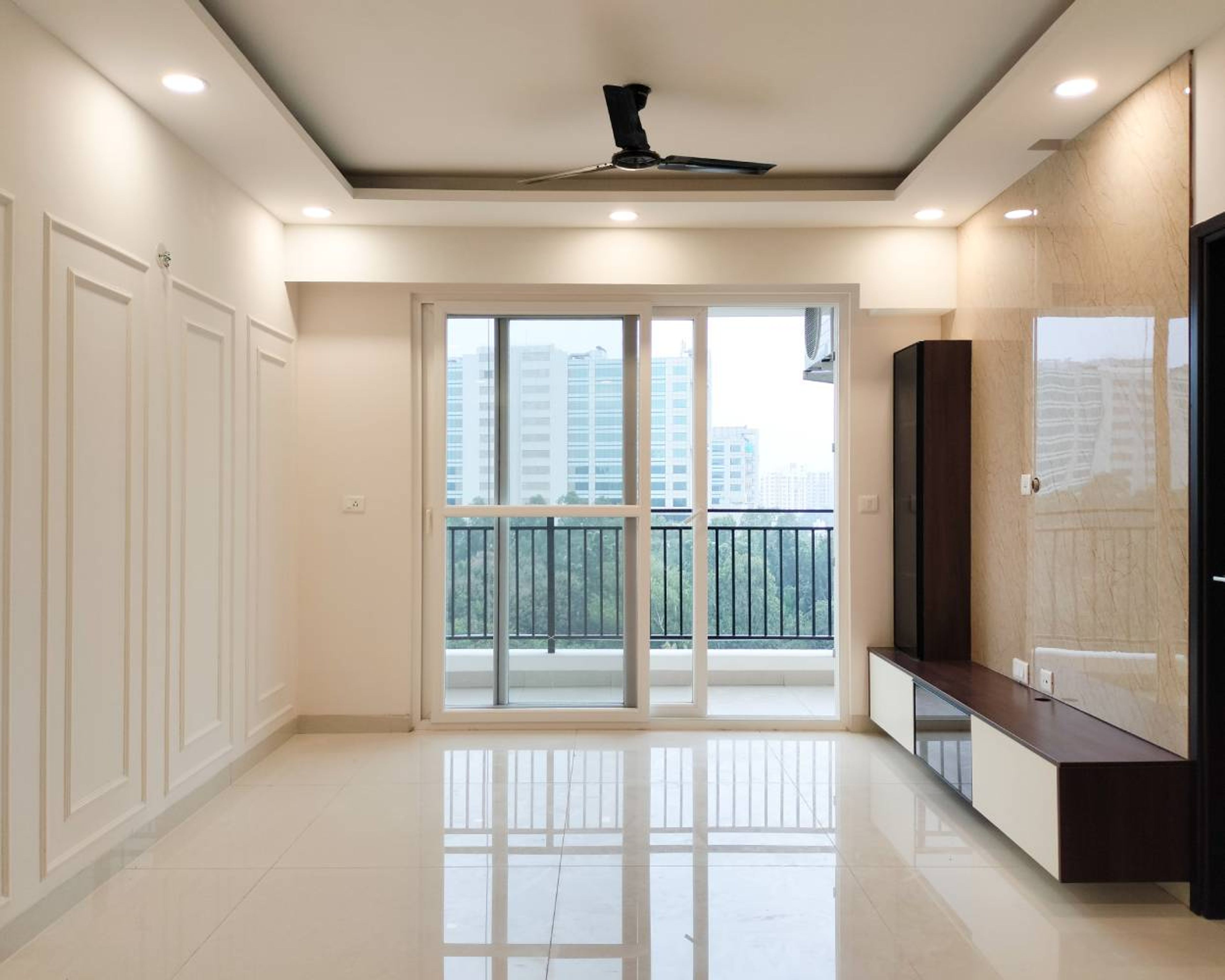 Living Room Design with White Wall Design with Trims and Wooden TV Unit
