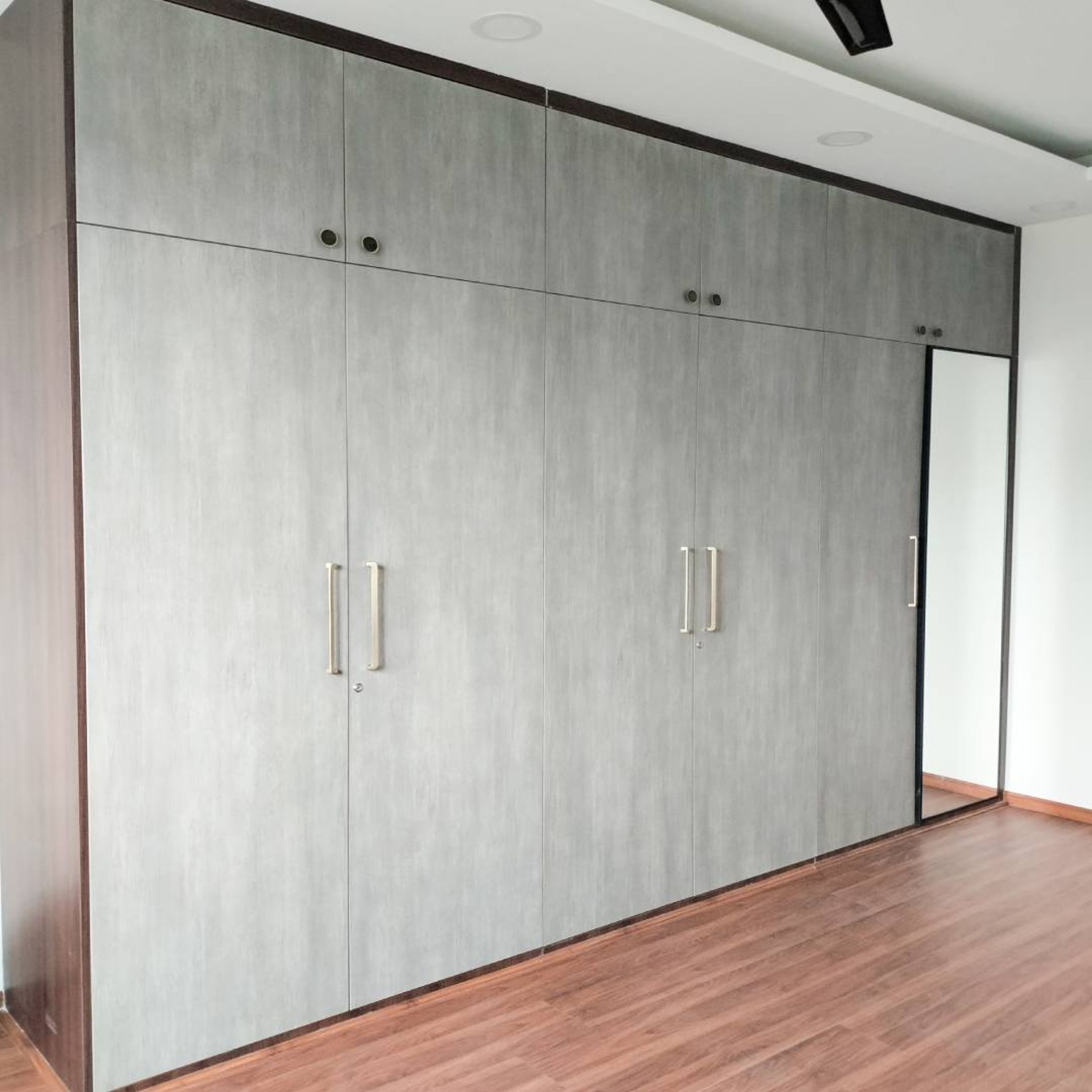 6-Door Swing Wardrobe Design with Integrated Mirror