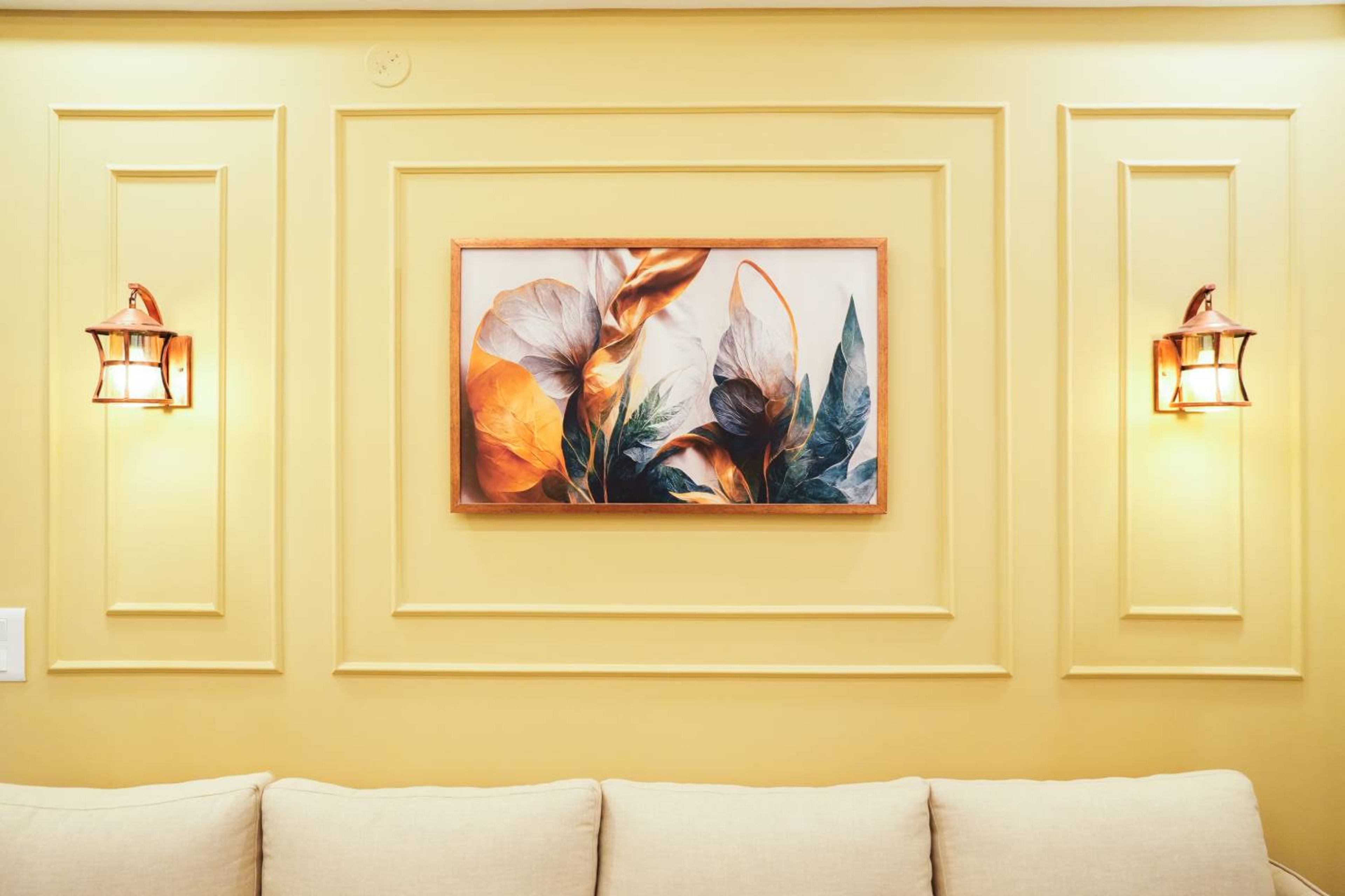 Light Yellow Wall Design with Trims and Artwork