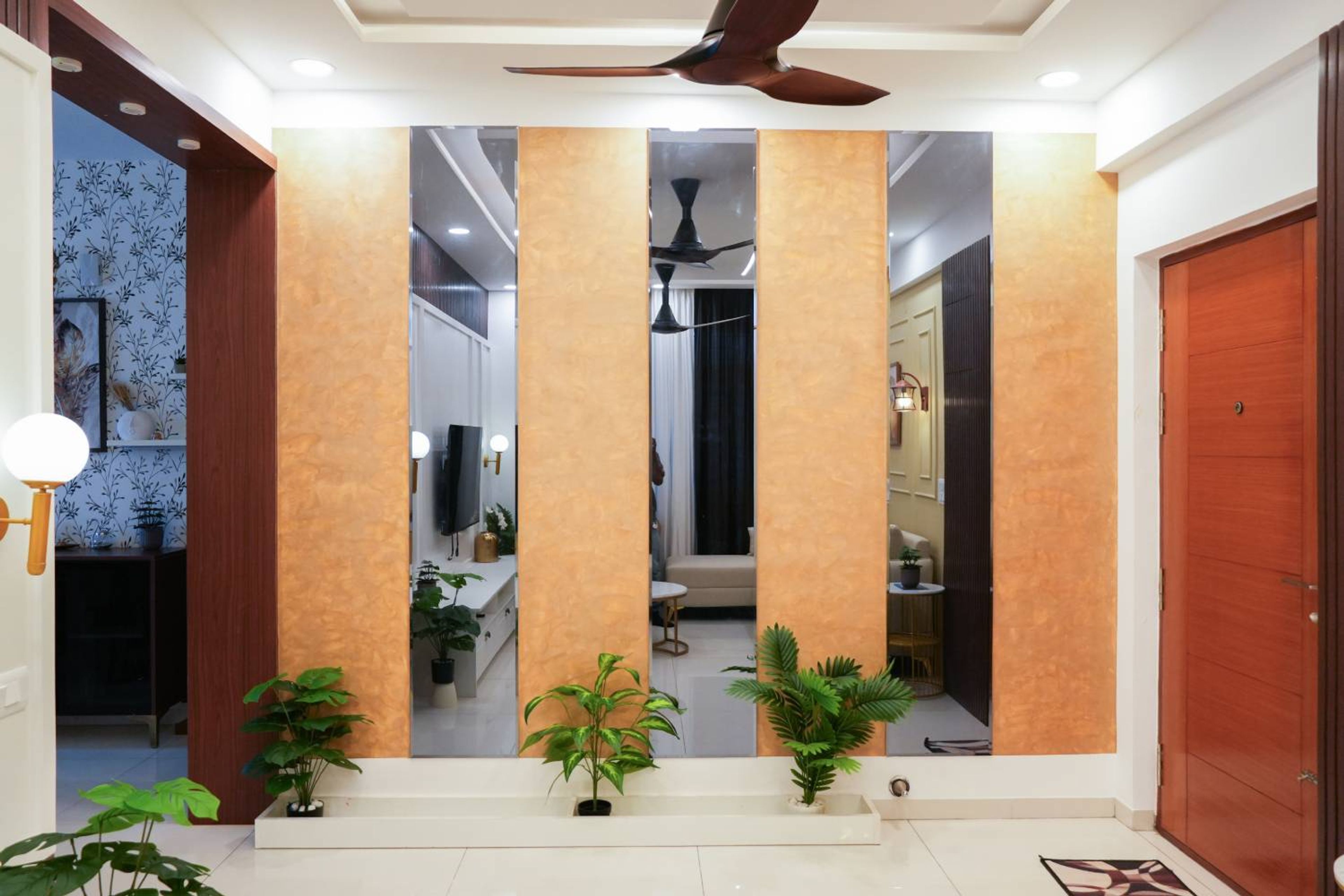 Foyer Design with Orange Wall with Glass Integration