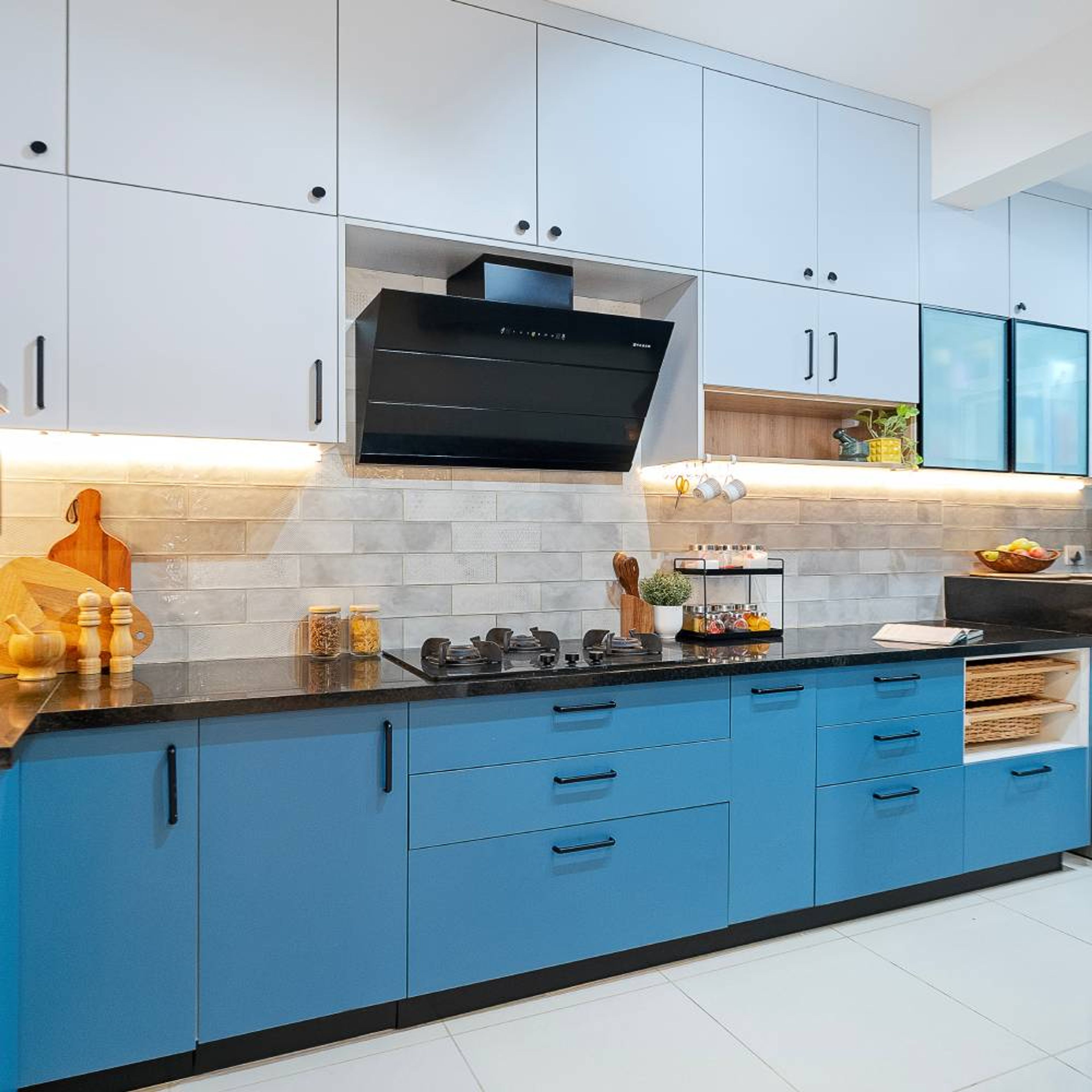 L-Shaped KItchen Design with Blue Units and Brick Patterned Backsplash Wall