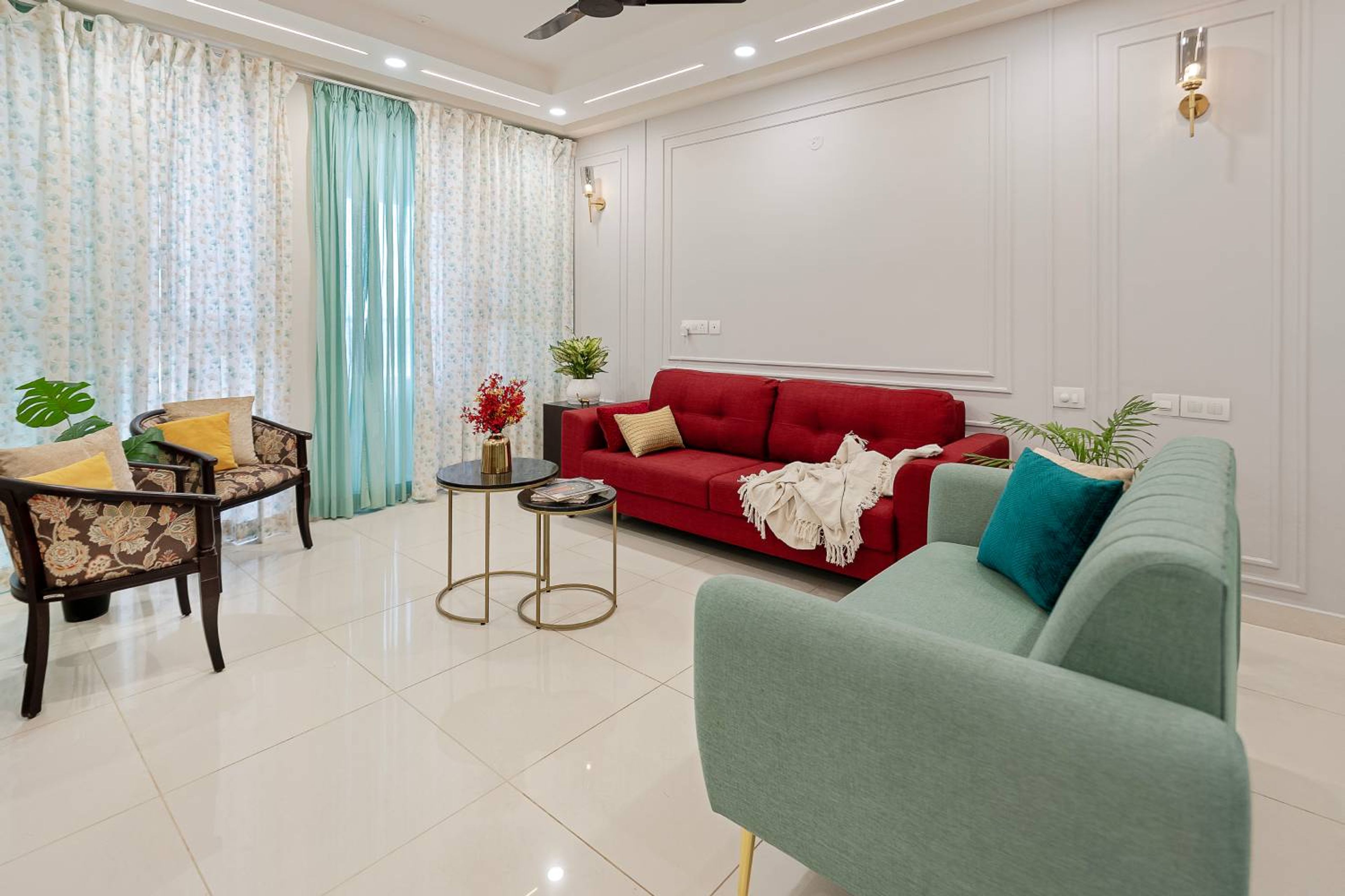 Living Room Design Featuring Red and Green Sofa Contrast and Floral Accent Chair