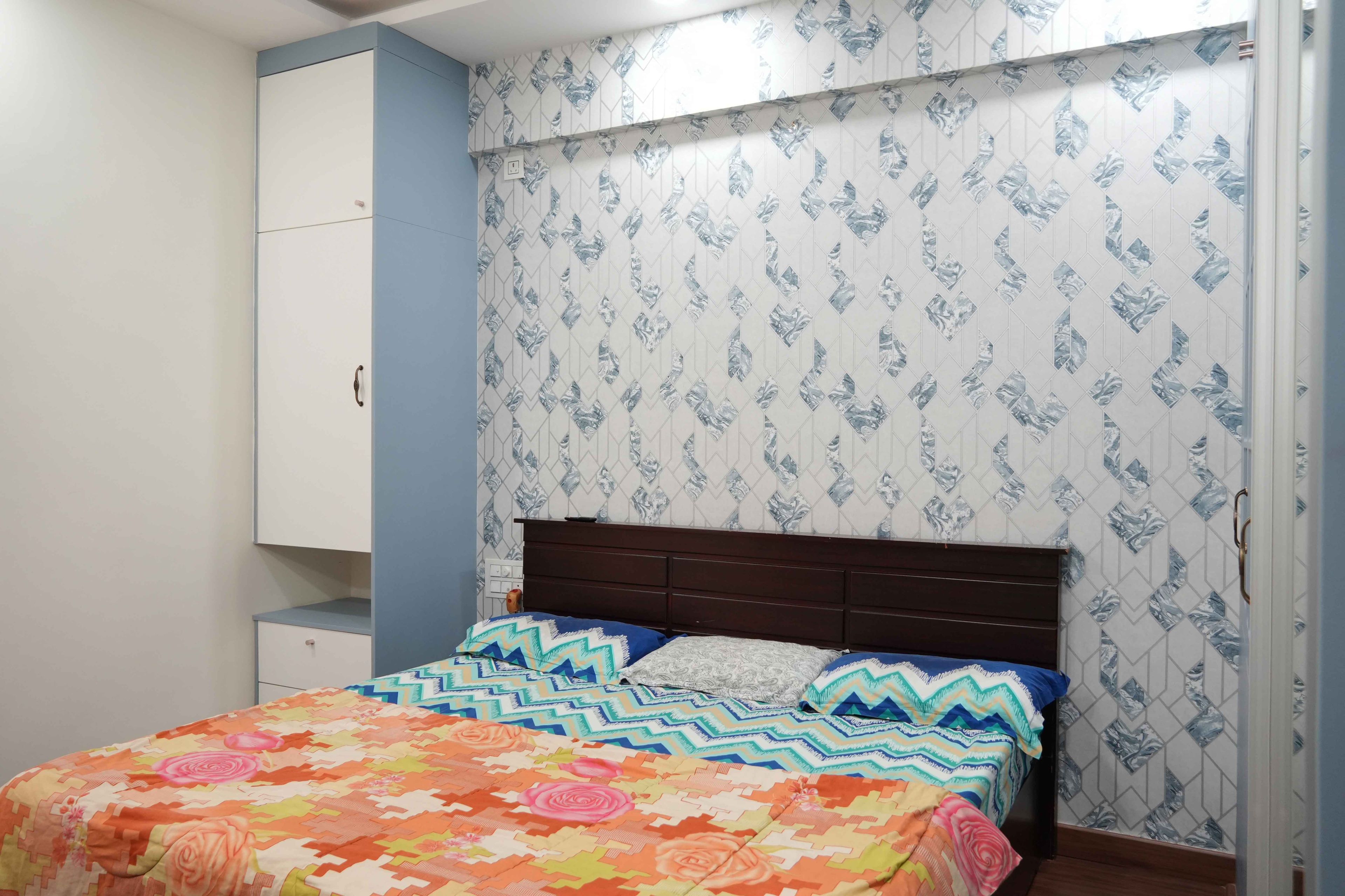 Bedroom Design with White and Blue Geometric Pattern Wallpaper and Wall Mounted Cabinets