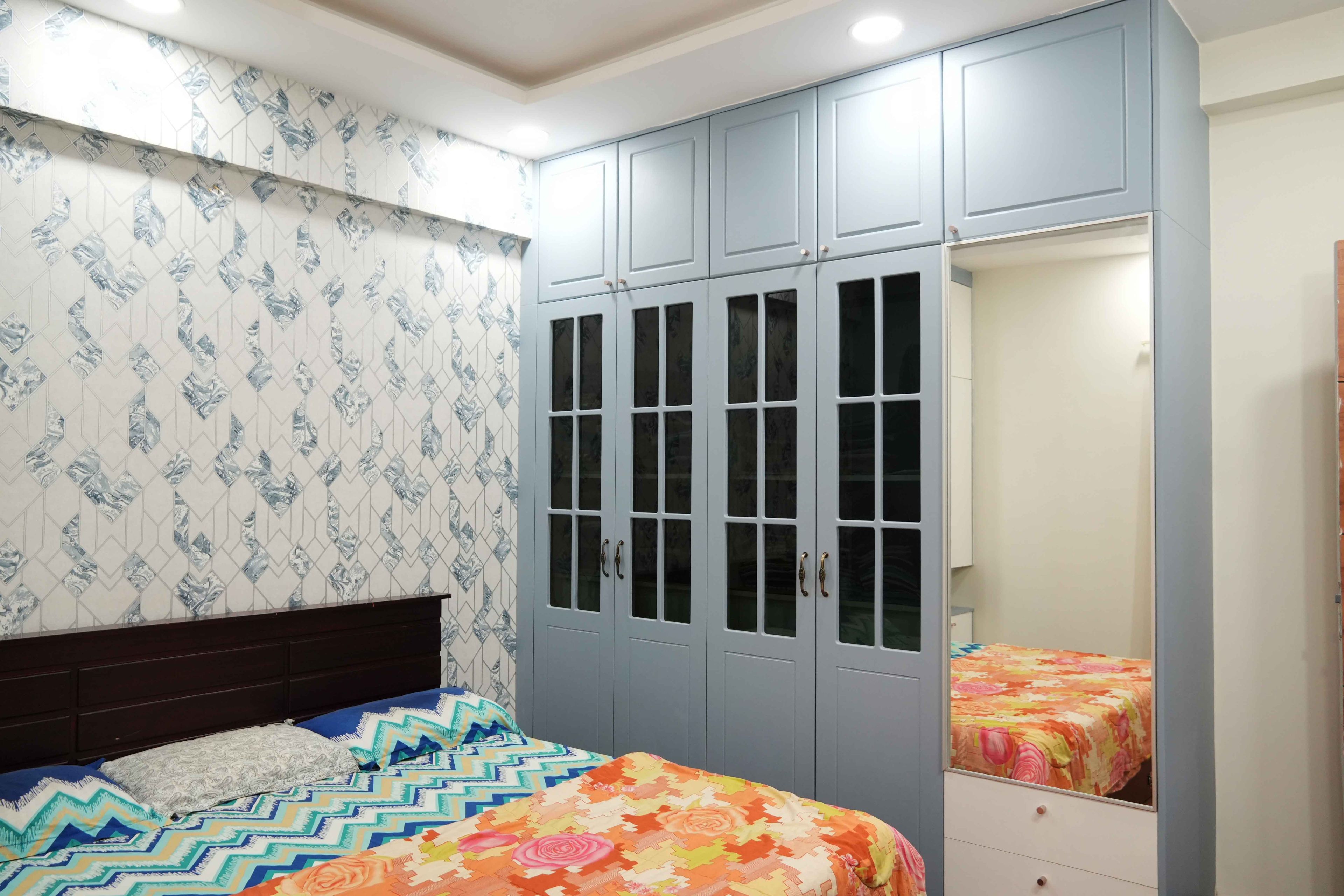 Bedroom Design with 4-Door Blue Profile Glass Shutter Swing Wardrobe Design with Integrated Mirror