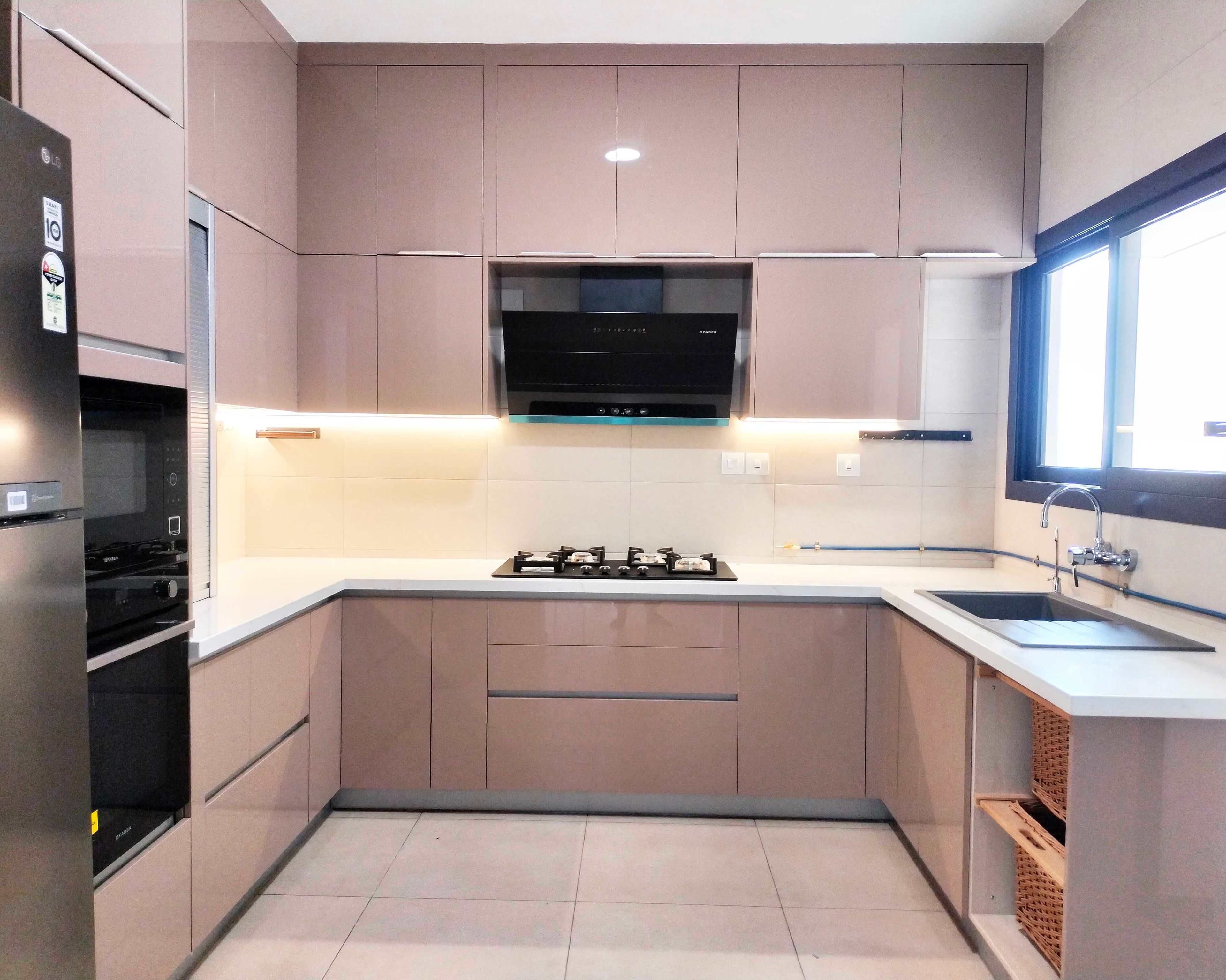 U-Shaped Kitchen Design with Peach Glossy Cabinets and White Countertop