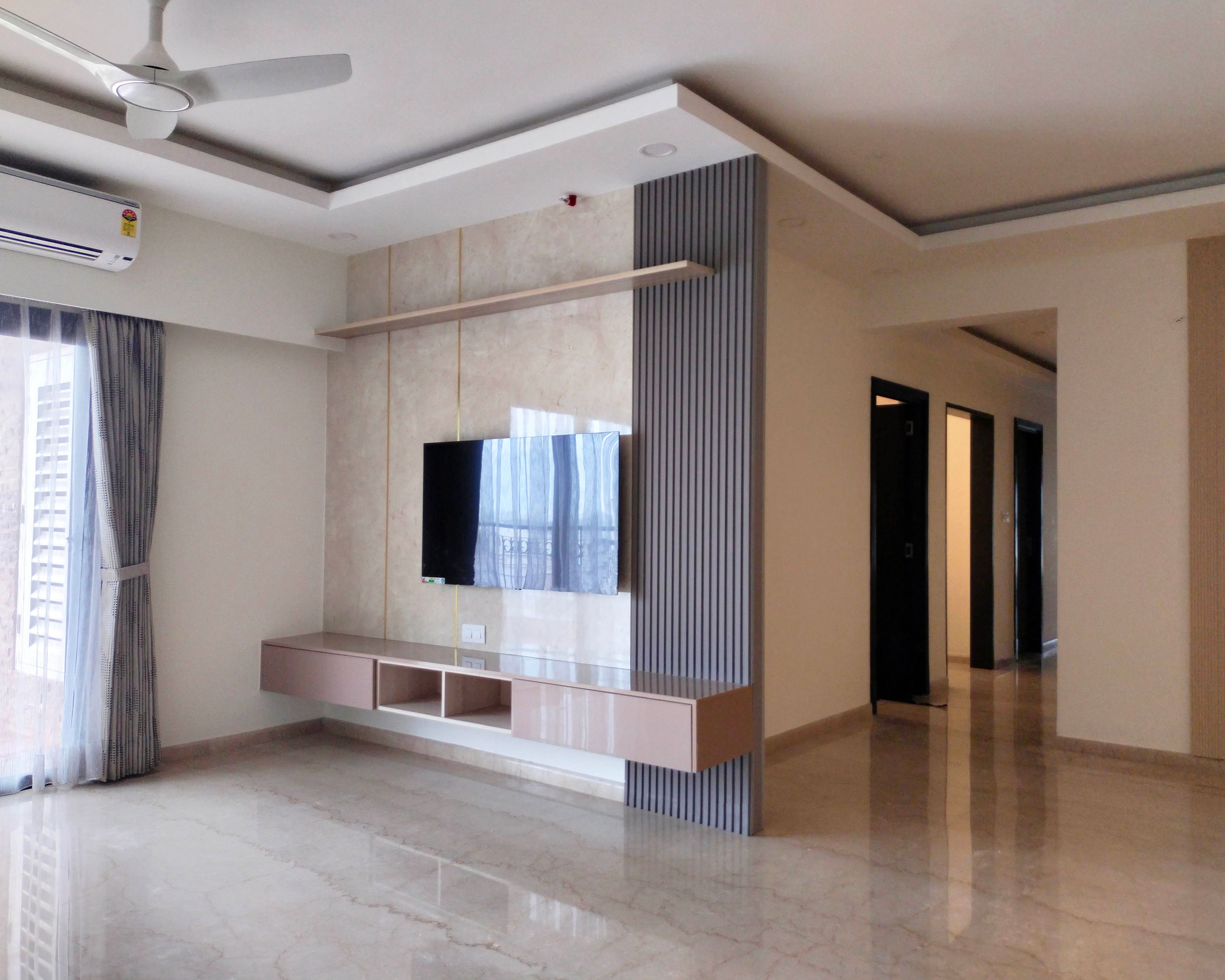 Living Room Design with Floating TV Unit, Textured Beige Wall Panel, Grey Fluted Panel, and Marble Flooring with False Ceiling