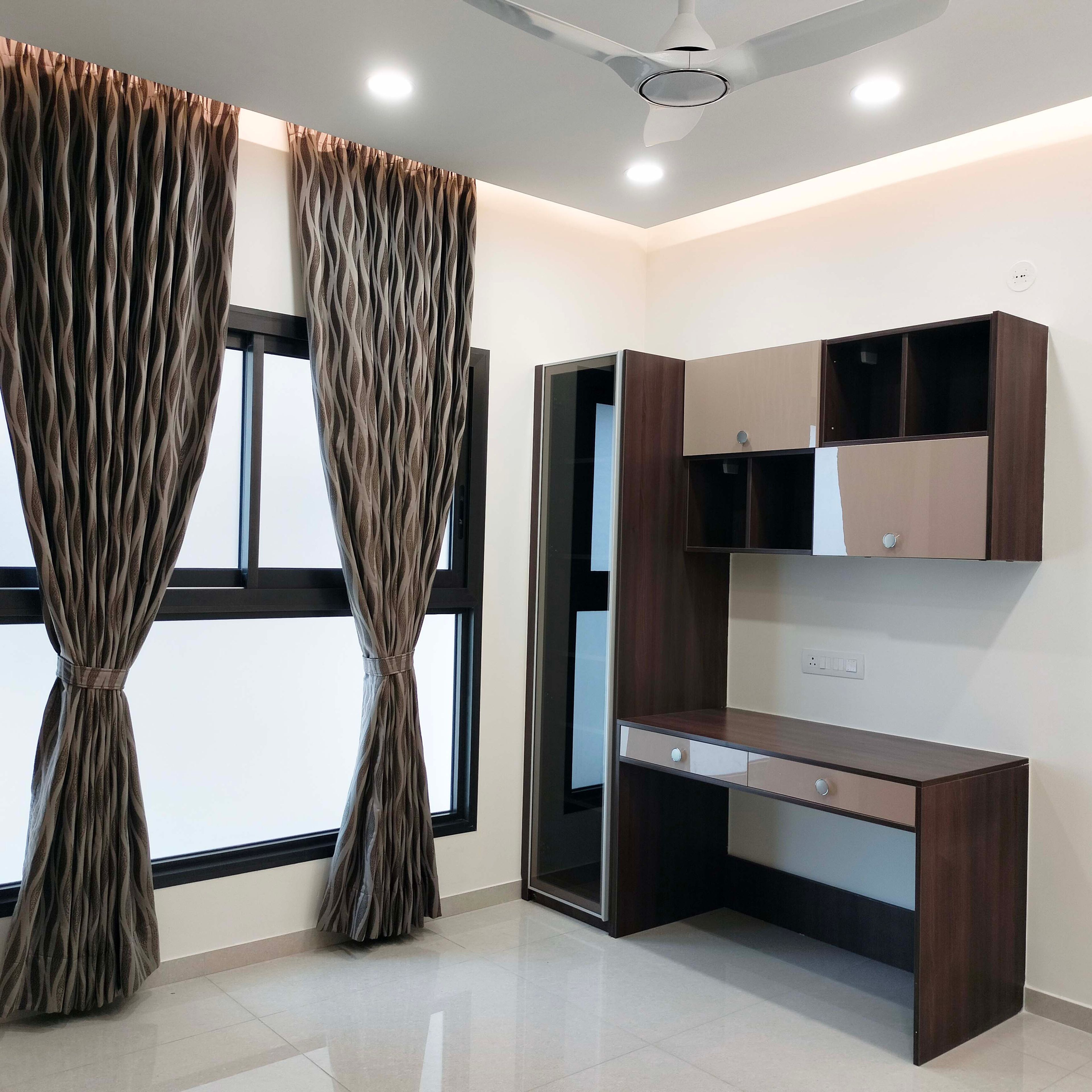 Wooden study space with tall unit