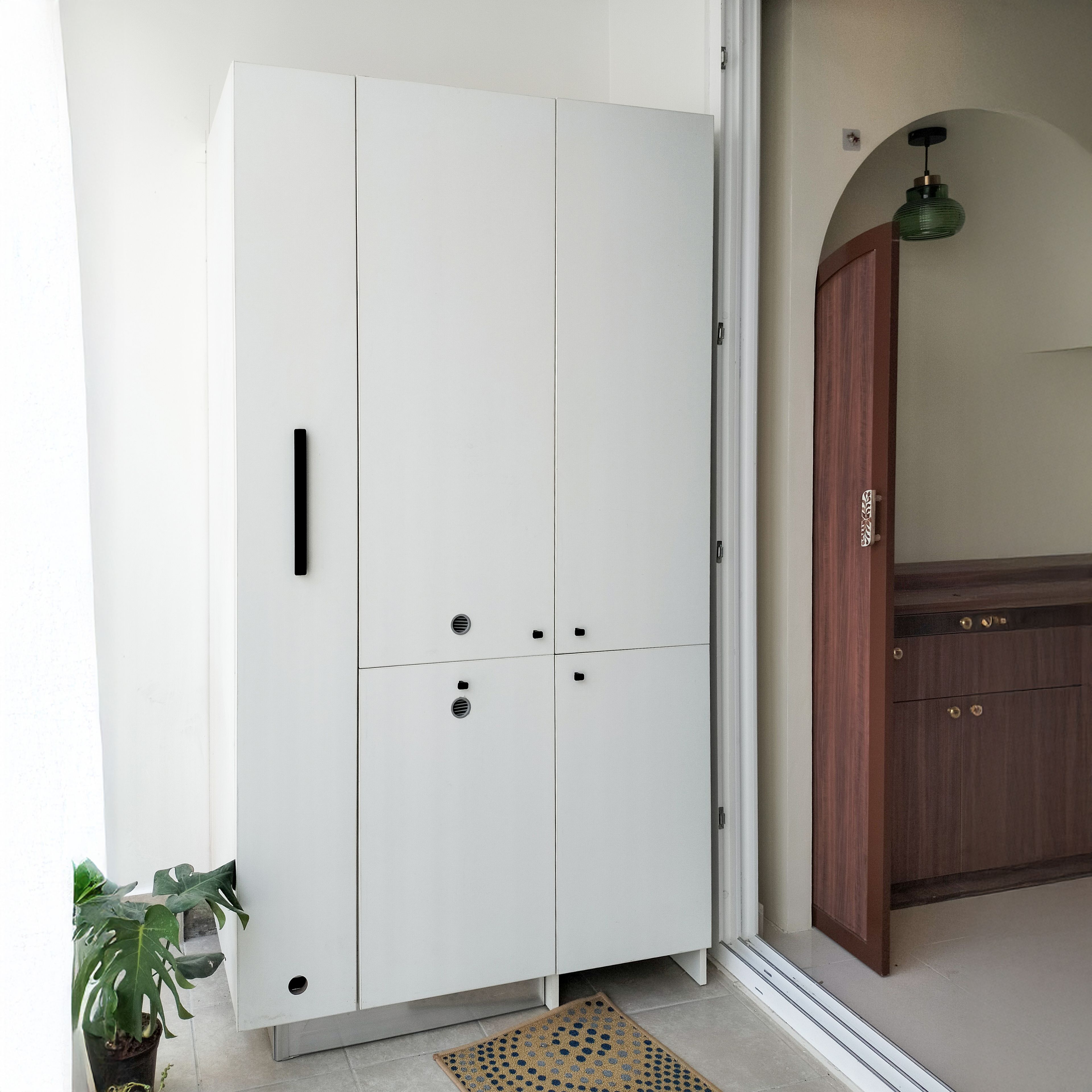 Foyer Design with White Shoe Cabinet and Storage Unit