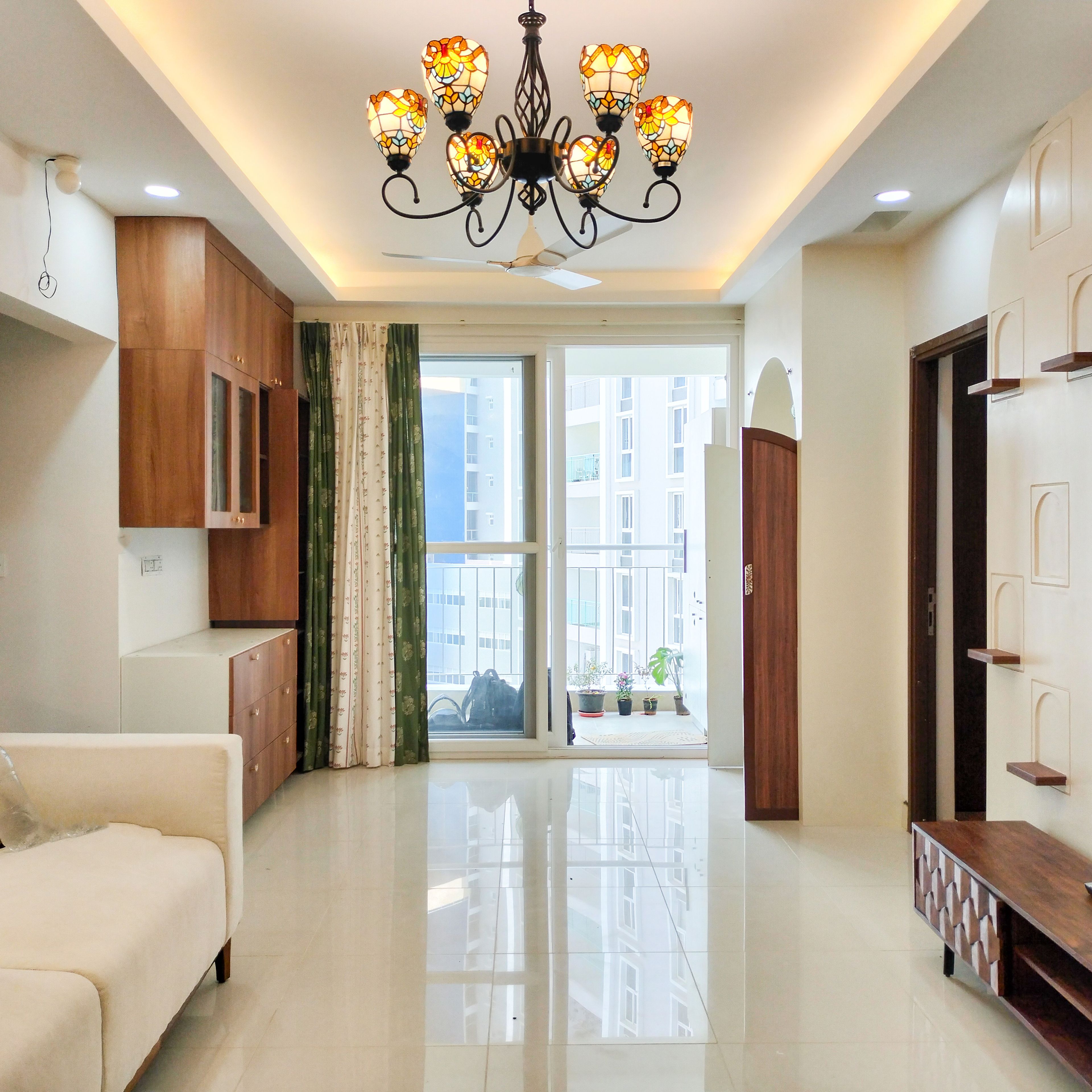 Living Room Design with Wooden Crockery Unit and Wooden TV Unit