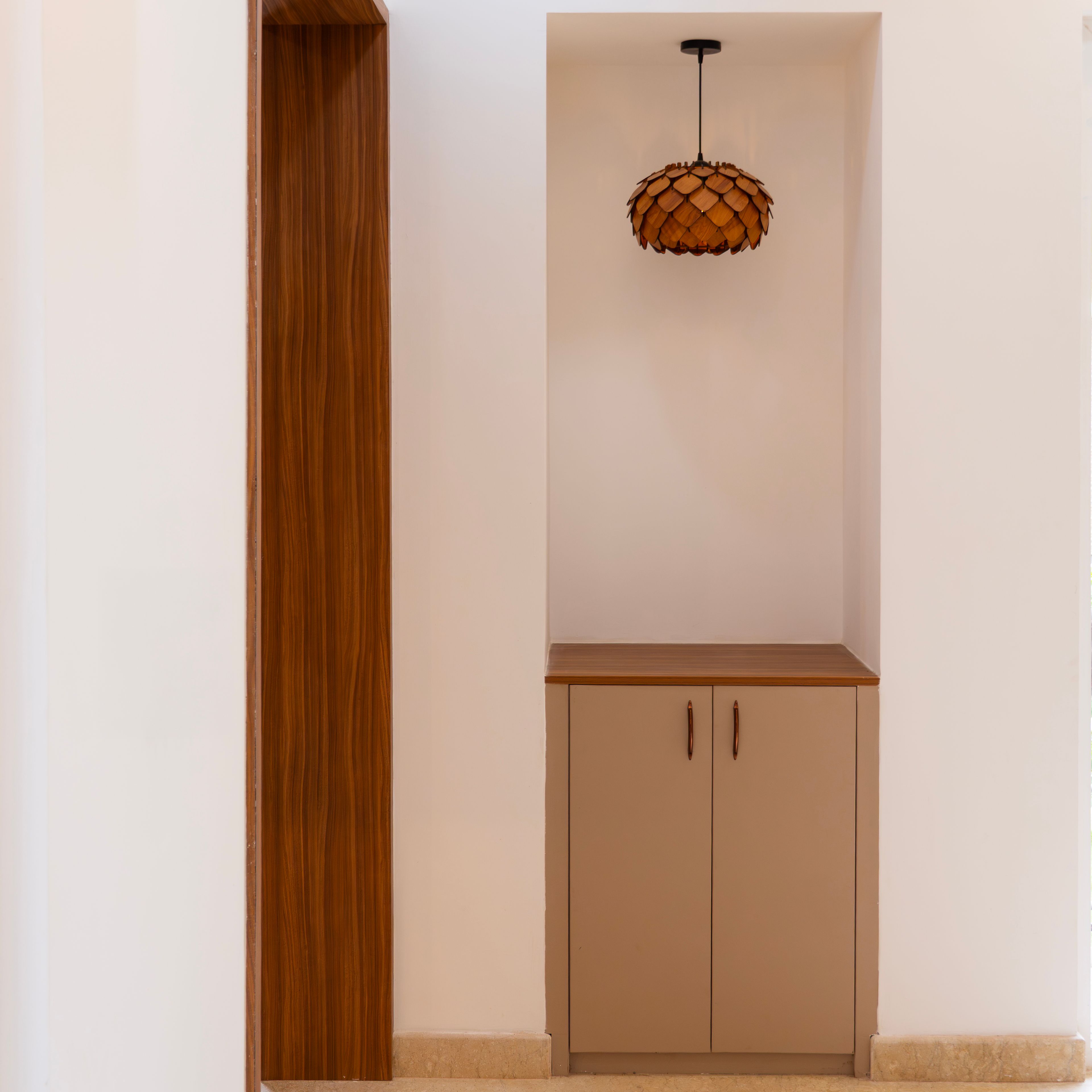 Foyer Design with Wooden Framed Storage and Pendant Light