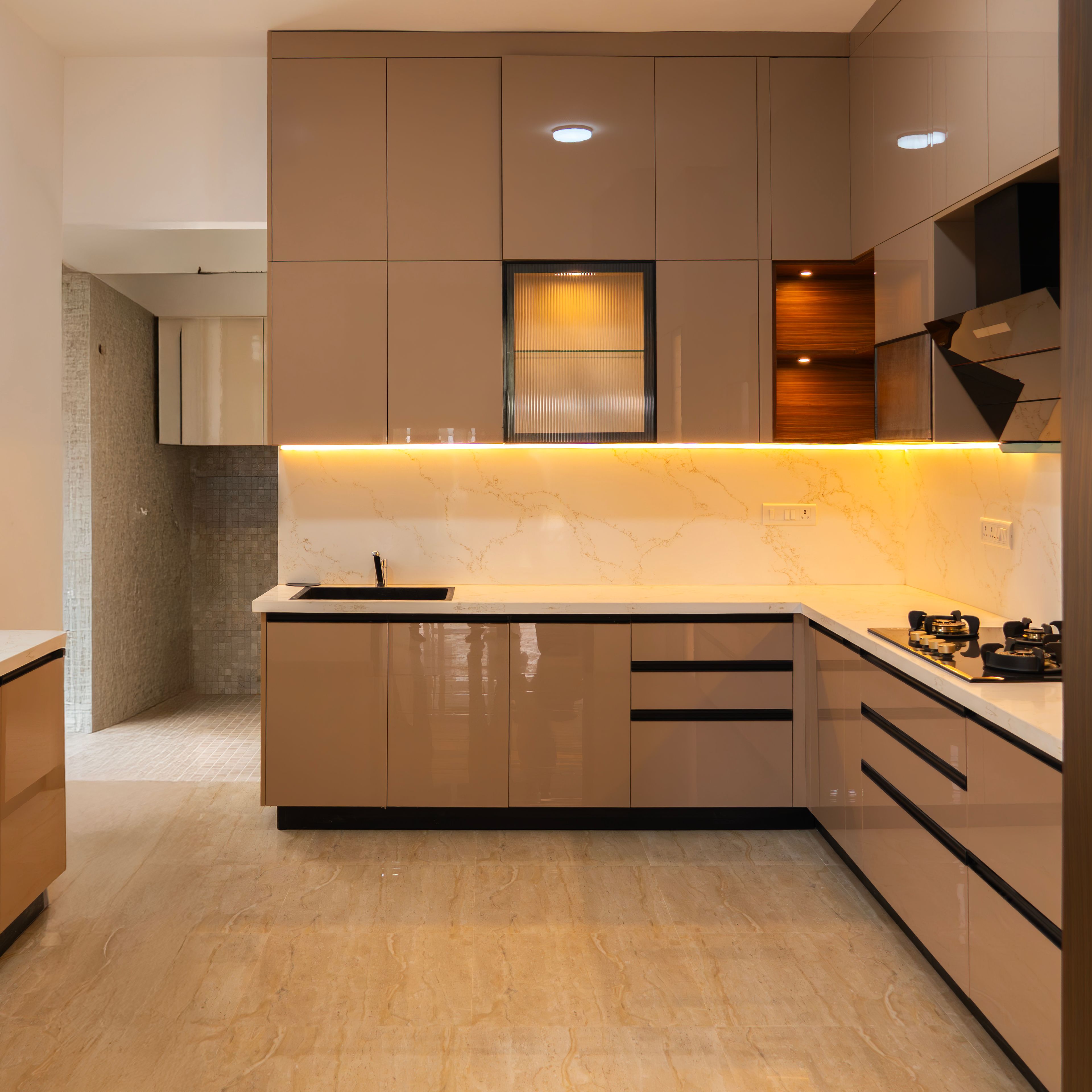 L-Shaped Kitchen Design with Beige Glossy Cabinets and Marble Backsplash