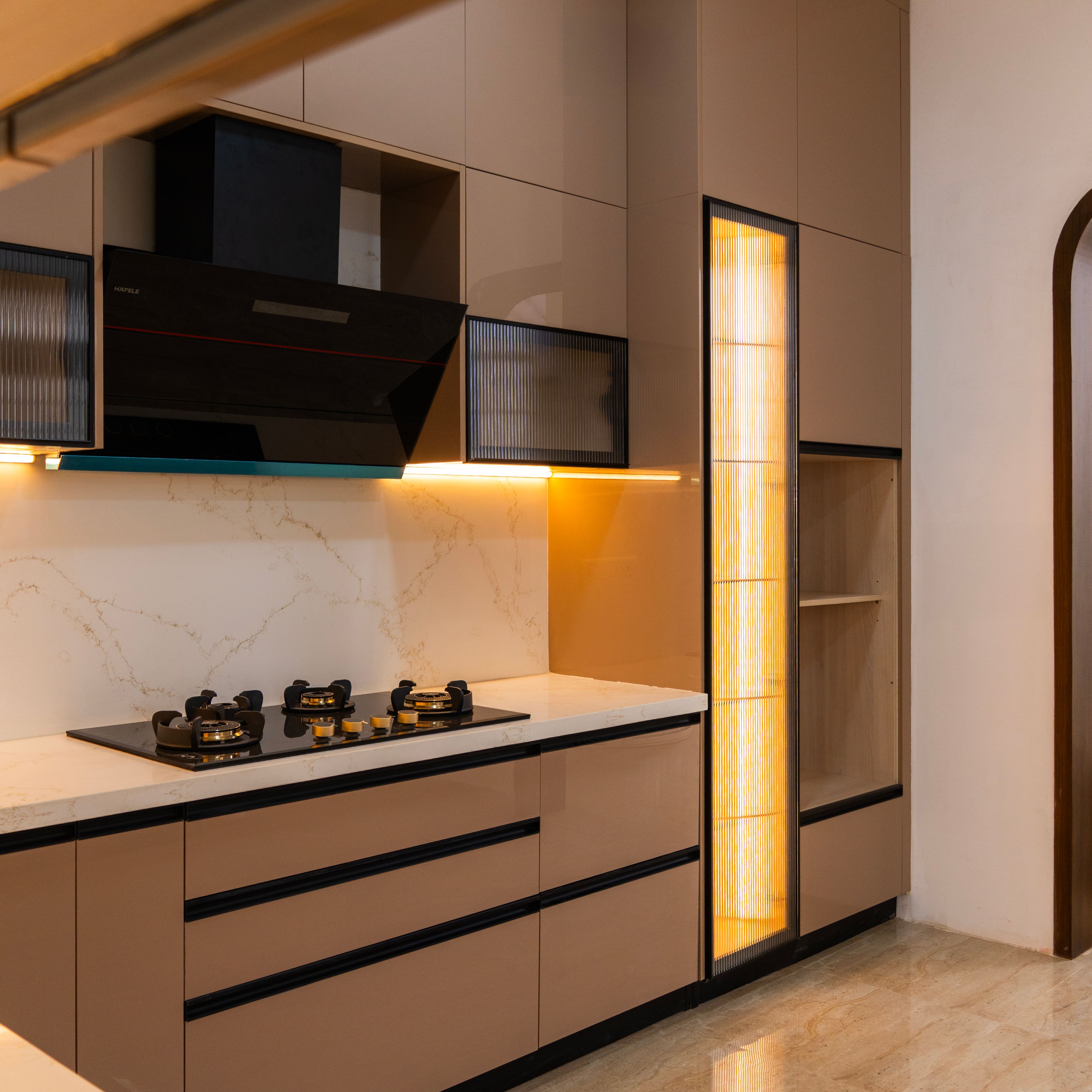 L-Shaped Kitchen Design with Glossy Beige Cabinets and Under Cabinet Lighting