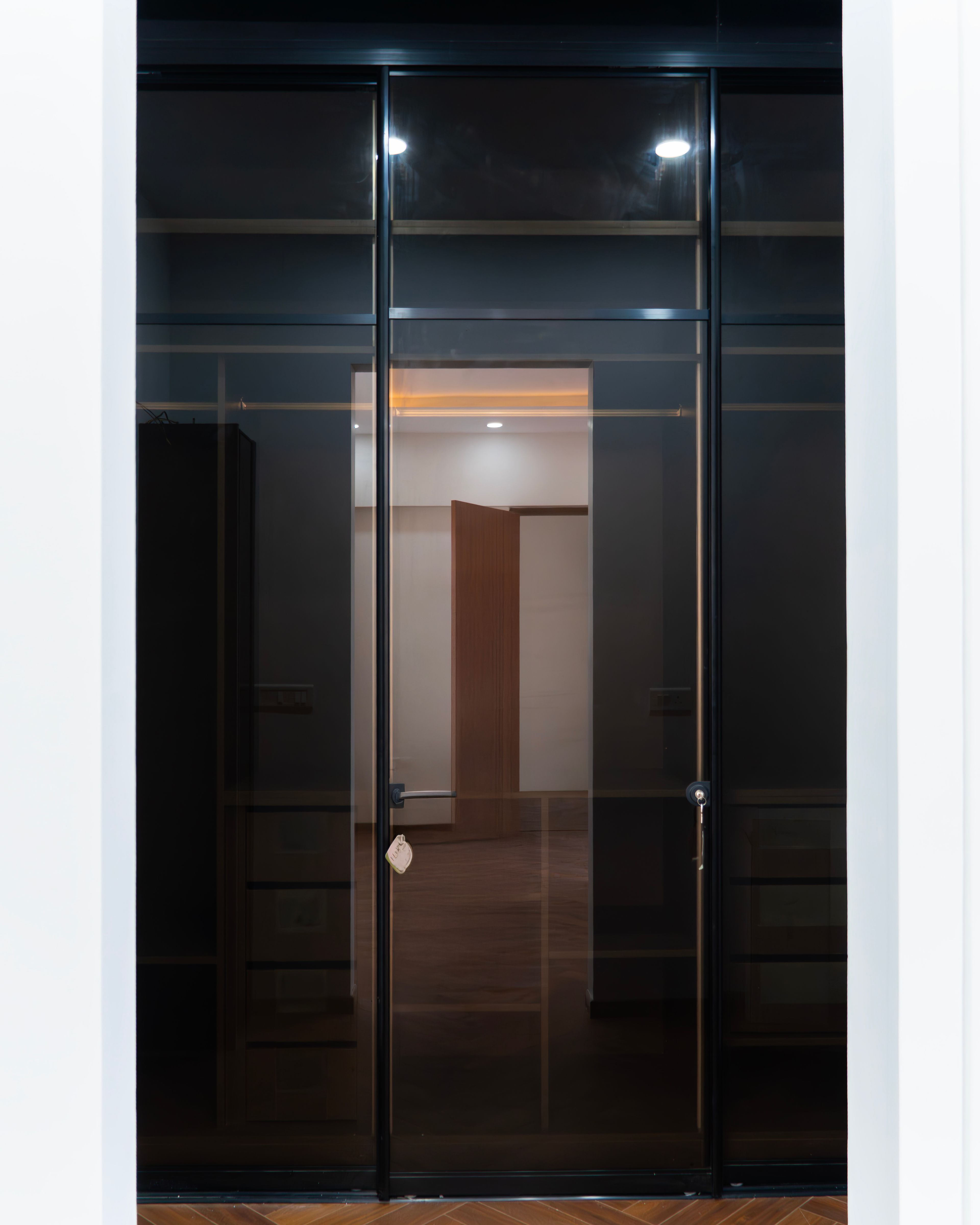 3-Door Tinted Black Glass Swing Wardrobe Design