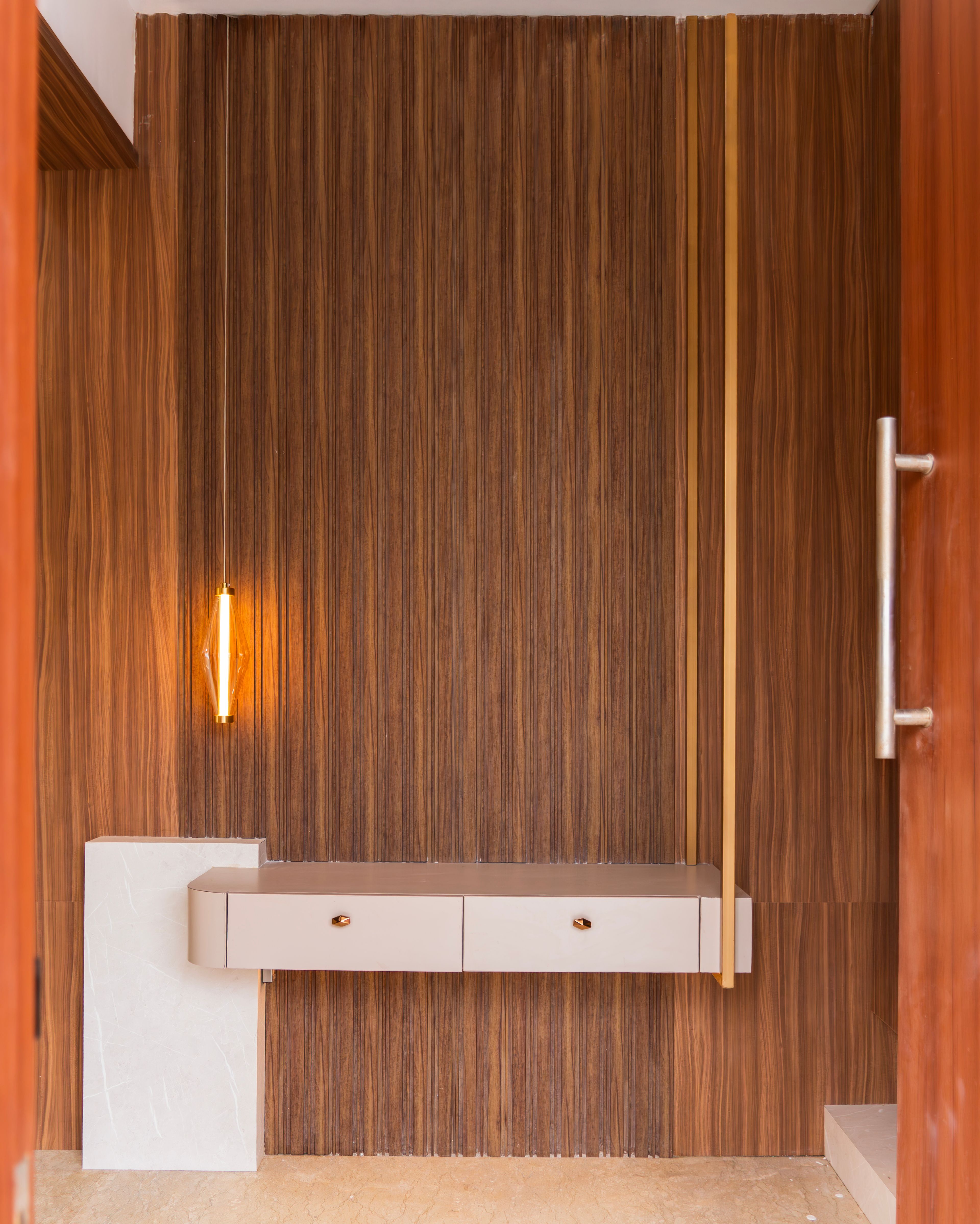 Foyer Design with Wooden Wall Panels and Beige Storage Cabinet