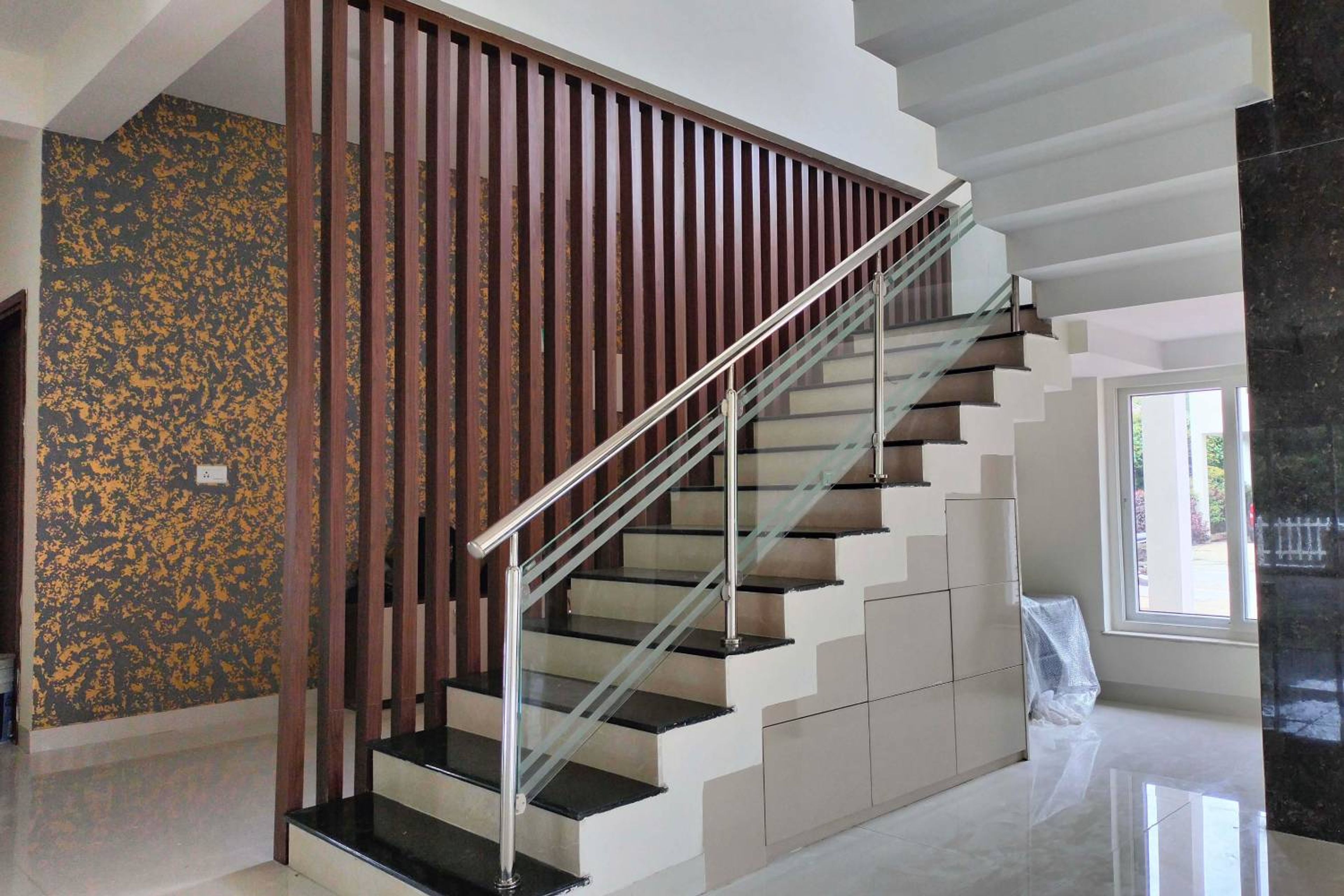 Modern L-Shaped Staircase Design With Granite Top And Glass Railing