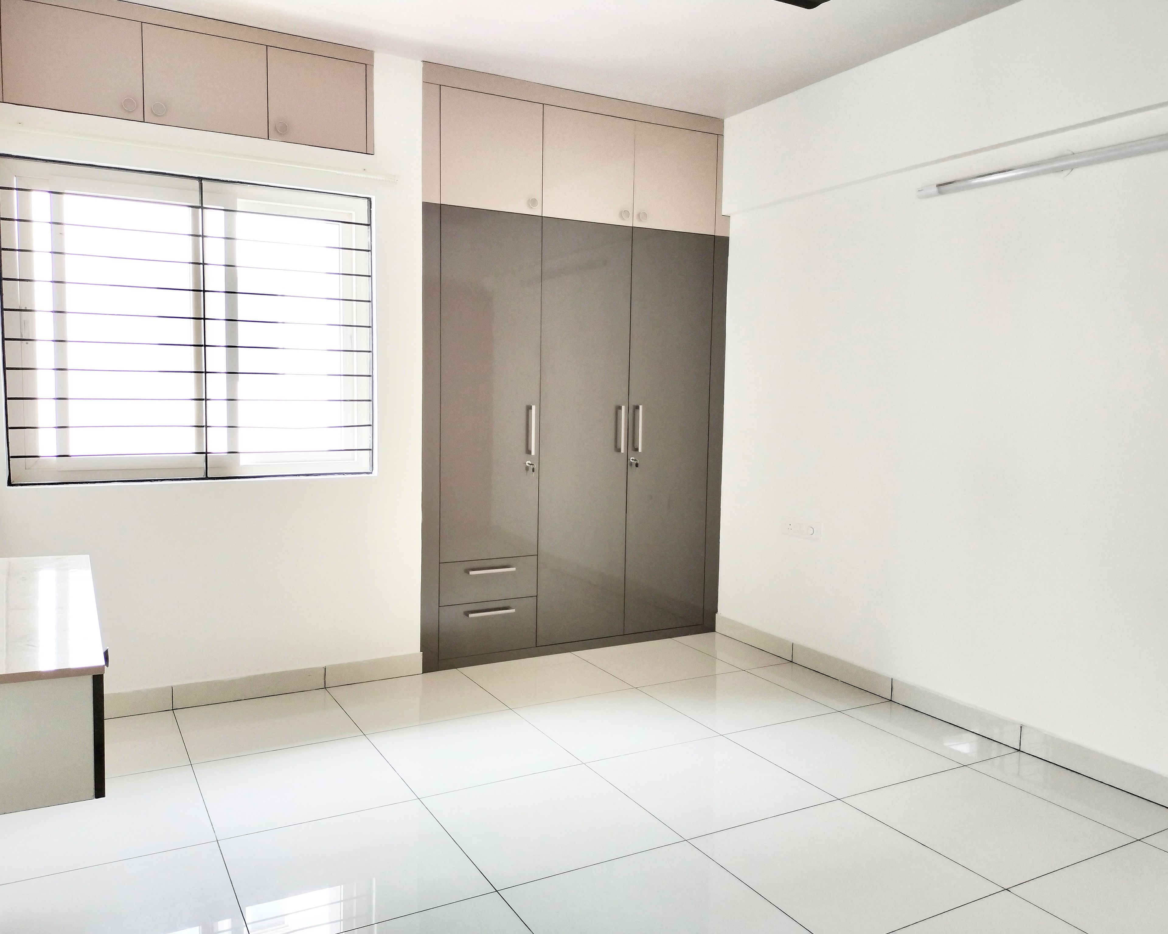 2-Door Greyish Brown Glossy Swing Wardrobe Design with Beige Loft Unit