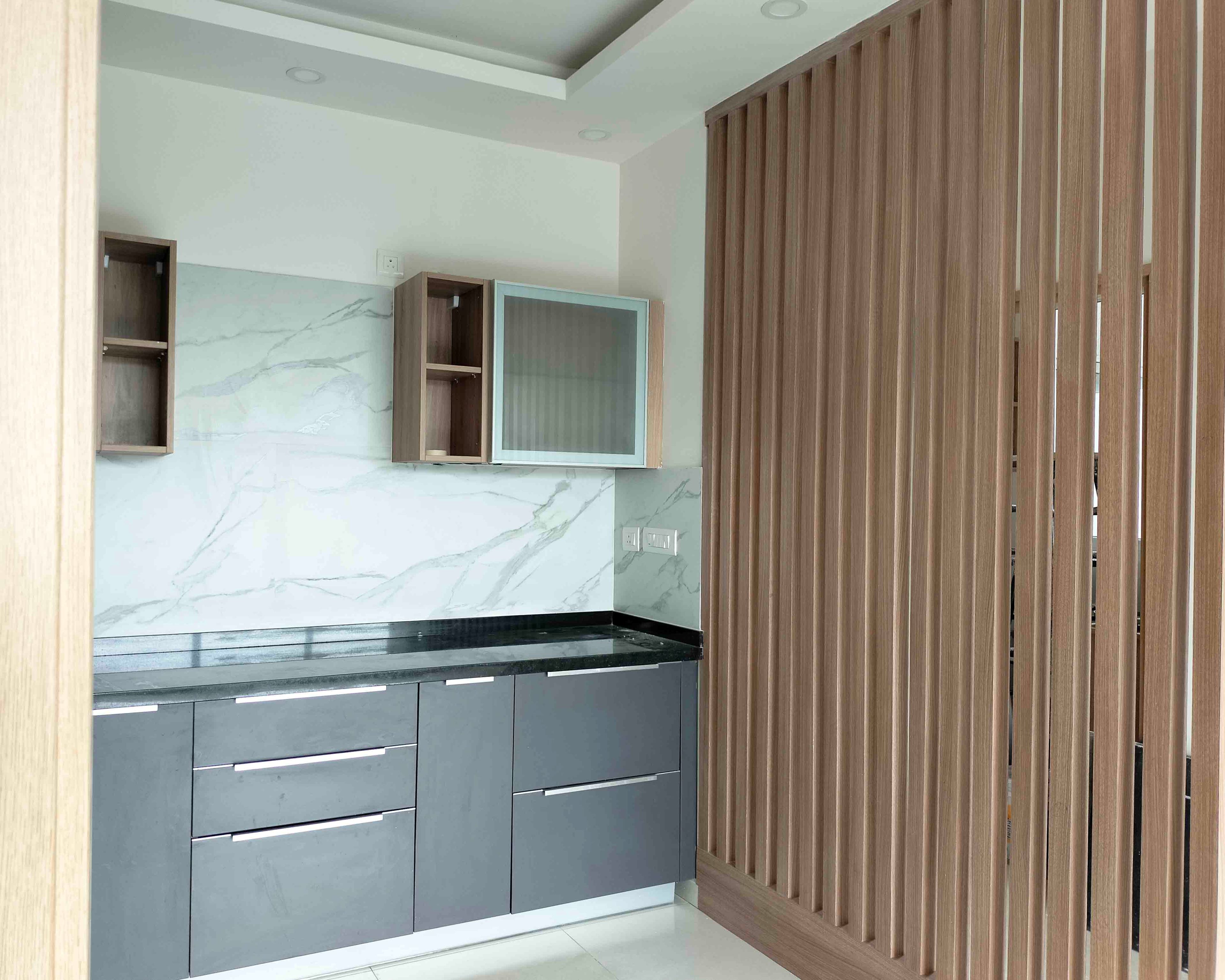 L-Shaped Kitchen Design with Wooden Slats Divider