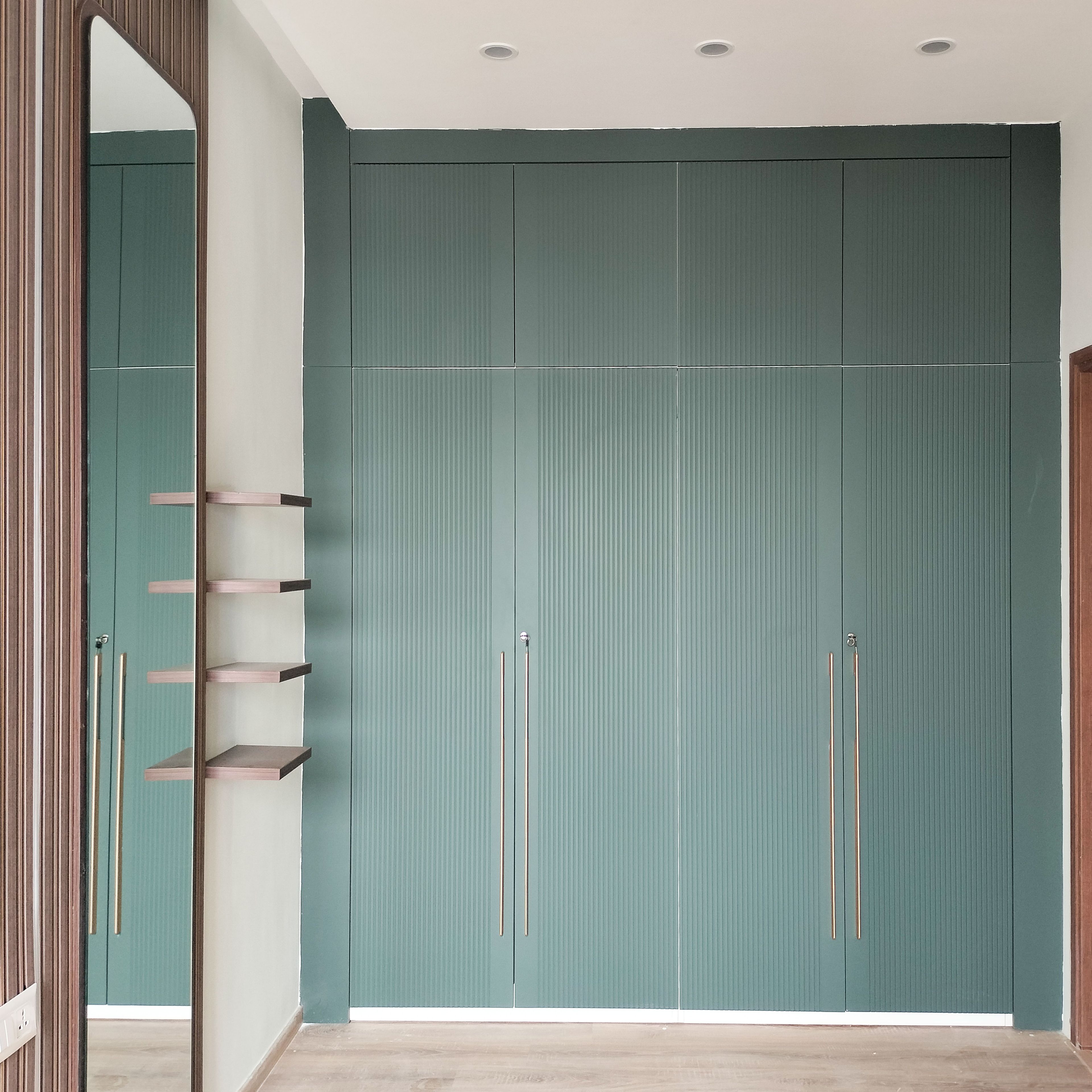 4-Door Green Swing Wardrobe Design with Loft unit