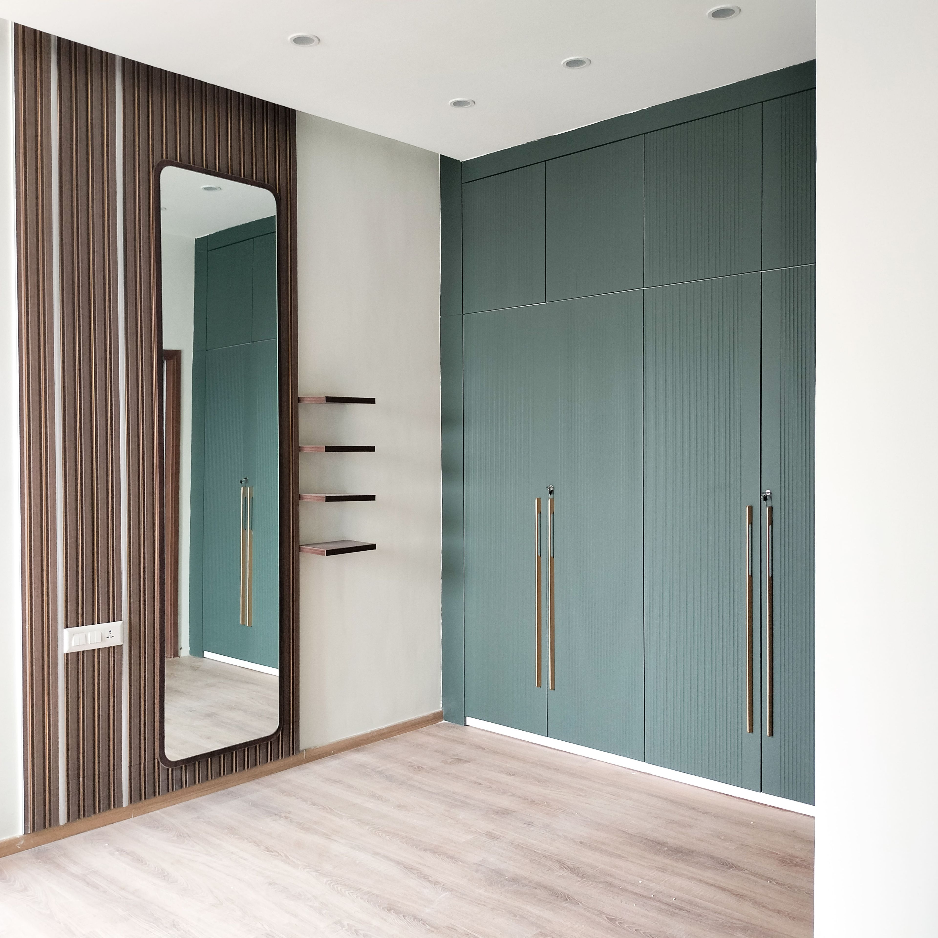 Brown Wall Slats Wall Design with Rectangular Mirror and 4-Door Green Swing Wardrobe