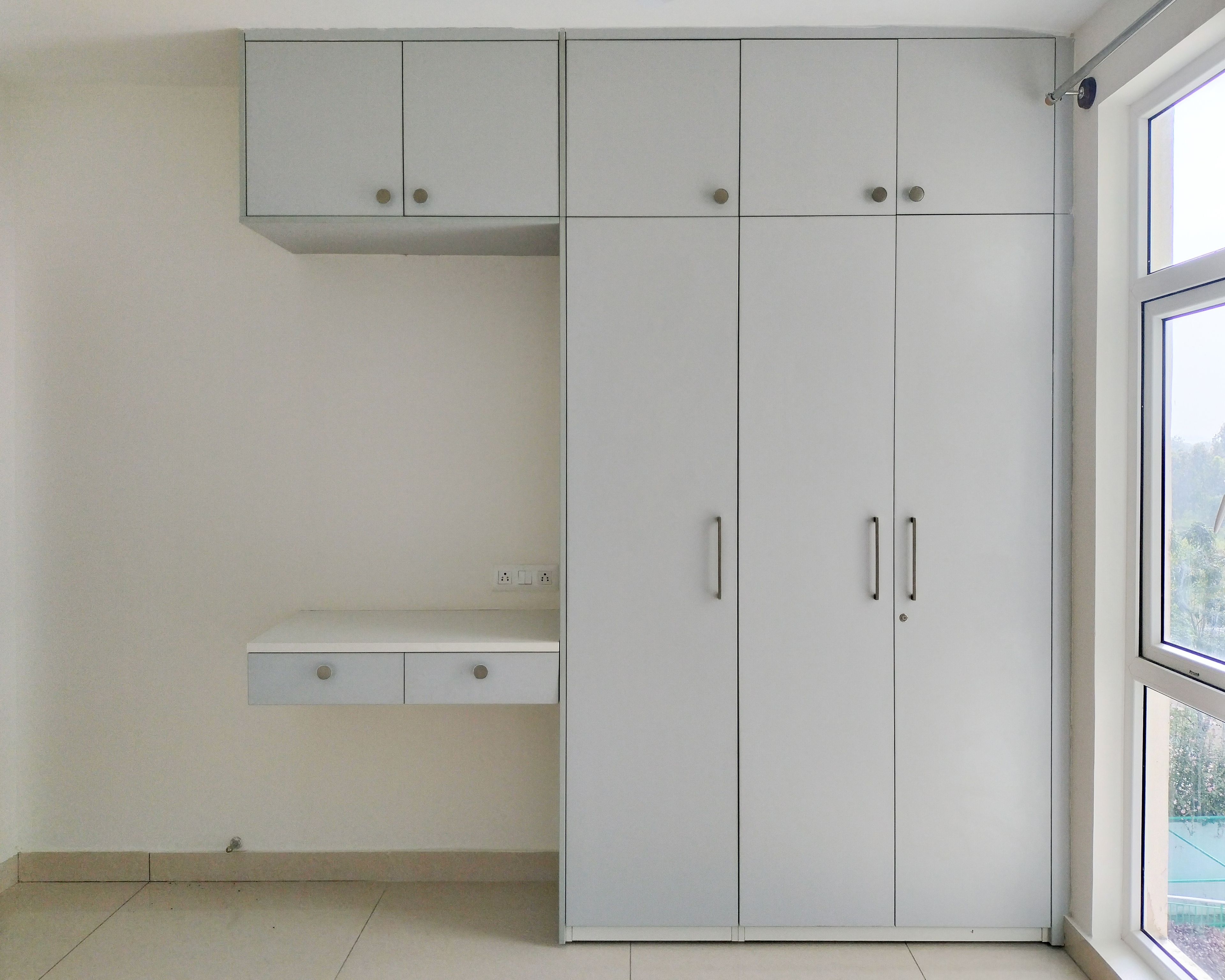 3-Door Grey Swing Wardrobe Design with Attached Study Unit