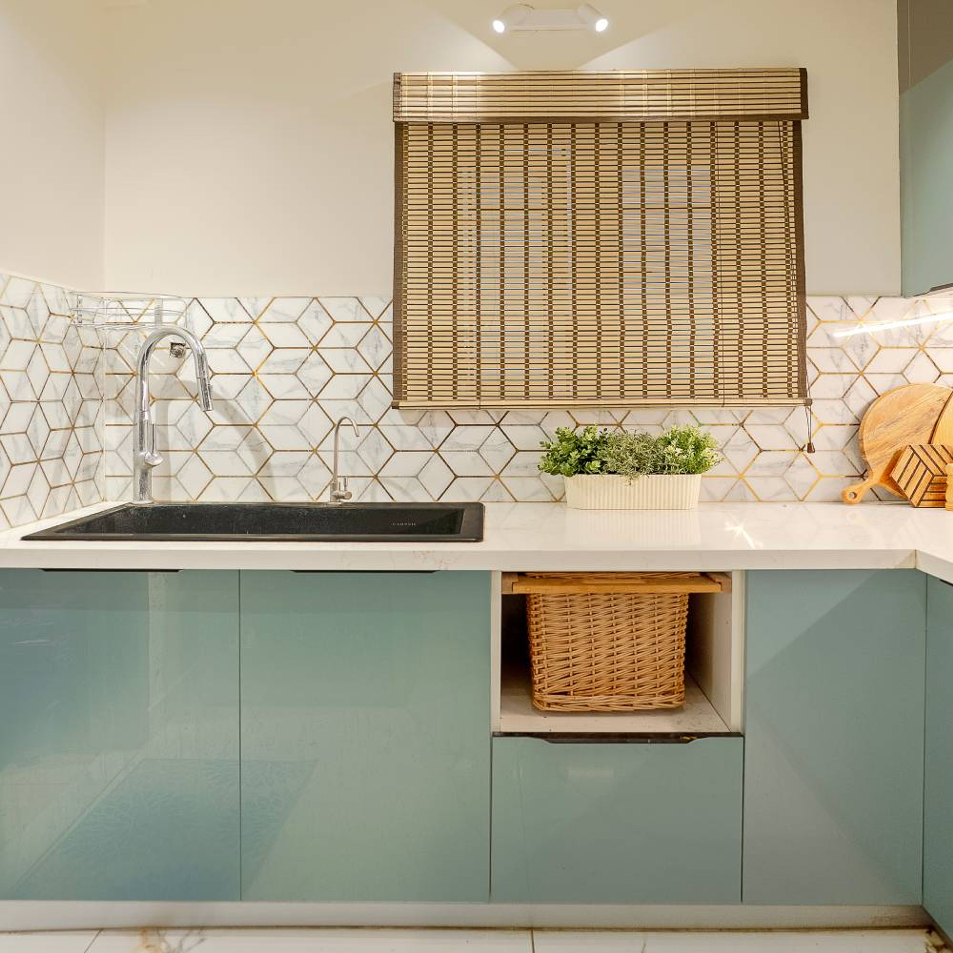 L-Shaped Kitchen Design with Wicker Baskets, Blue Base Units and Geometric Patterned White Backsplash Wall