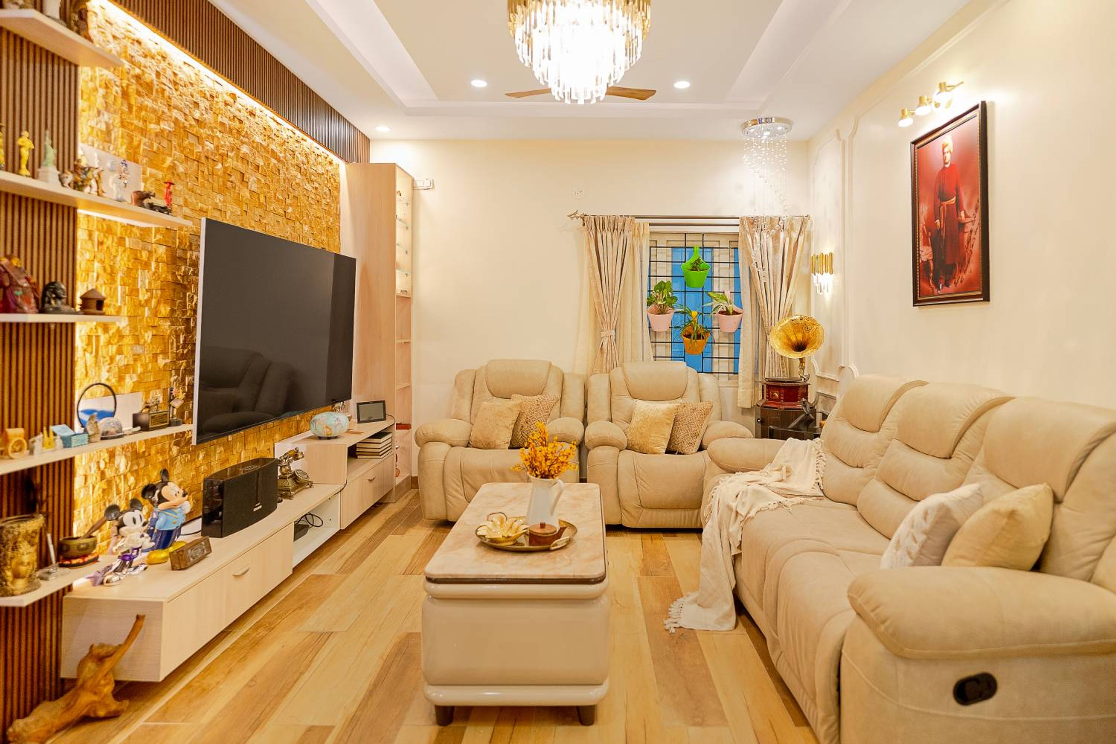 Living Room Design with Off-White Cushioned Sofas and TV Unit with Golden 3D Texture Backsplash Wall