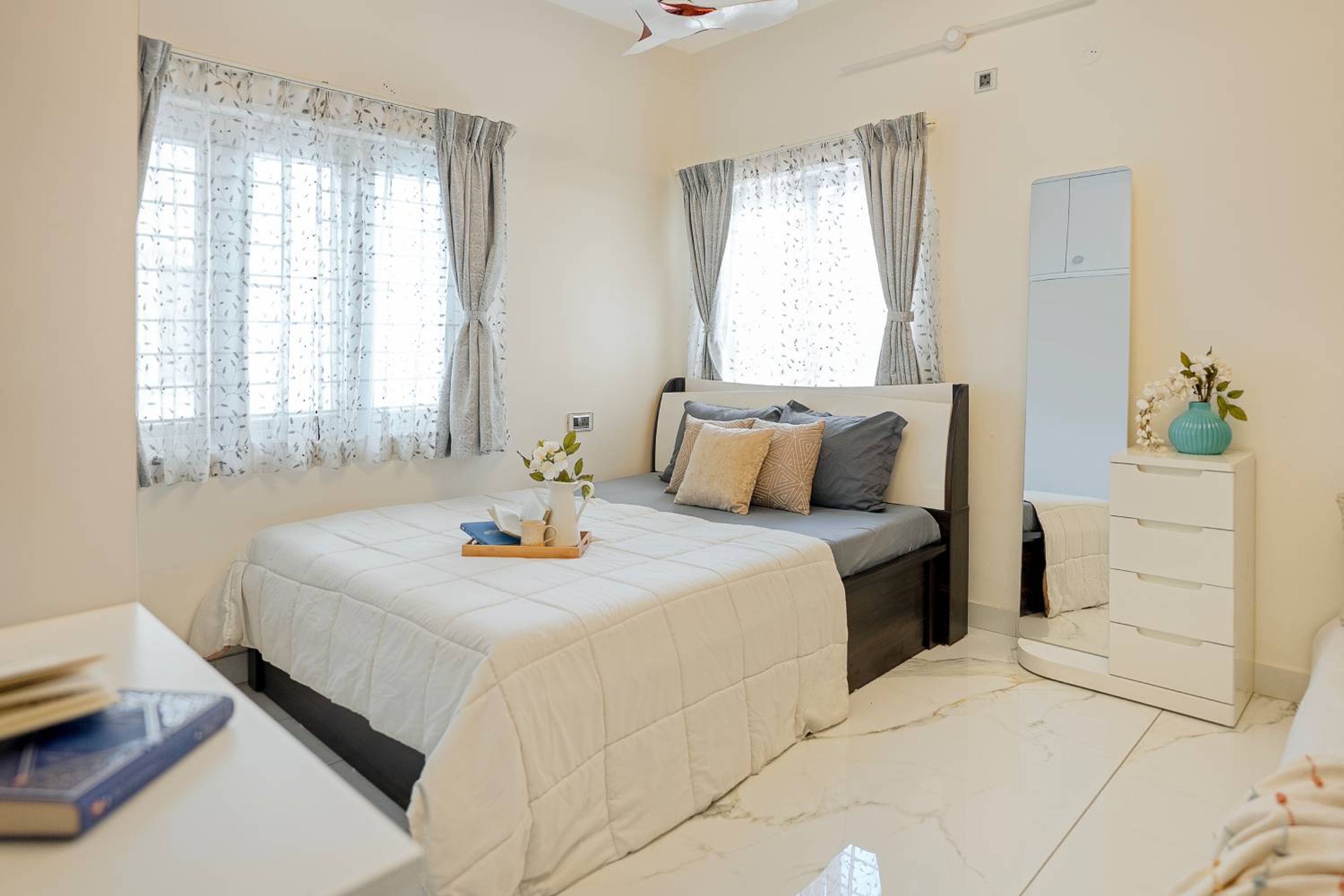 Modern Master Bedroom Design with Full-Length Mounted Mirror, Sofa Bed and Open Shelving