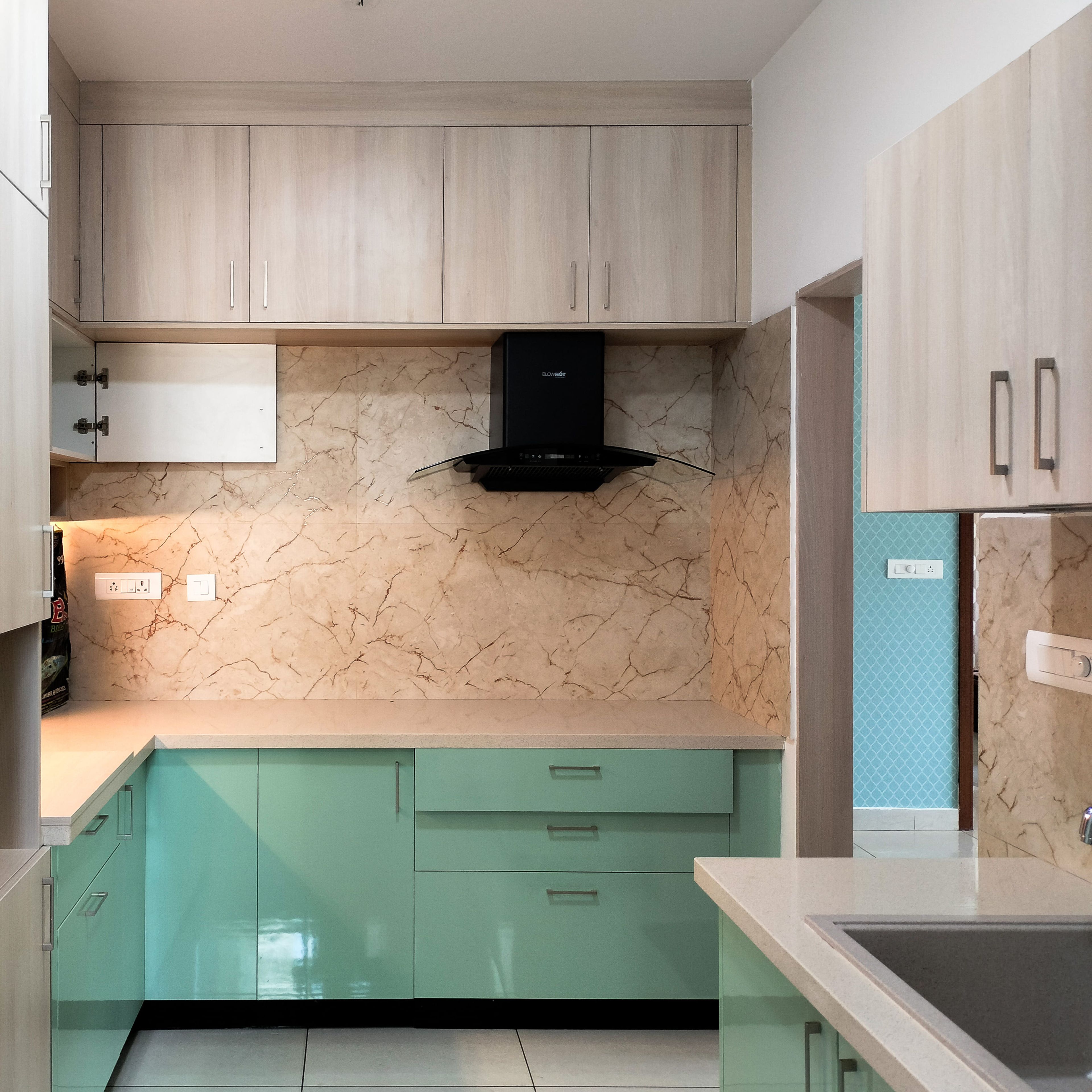 L-Shaped Kitchen Design with Sea Green and Natural Wood Units