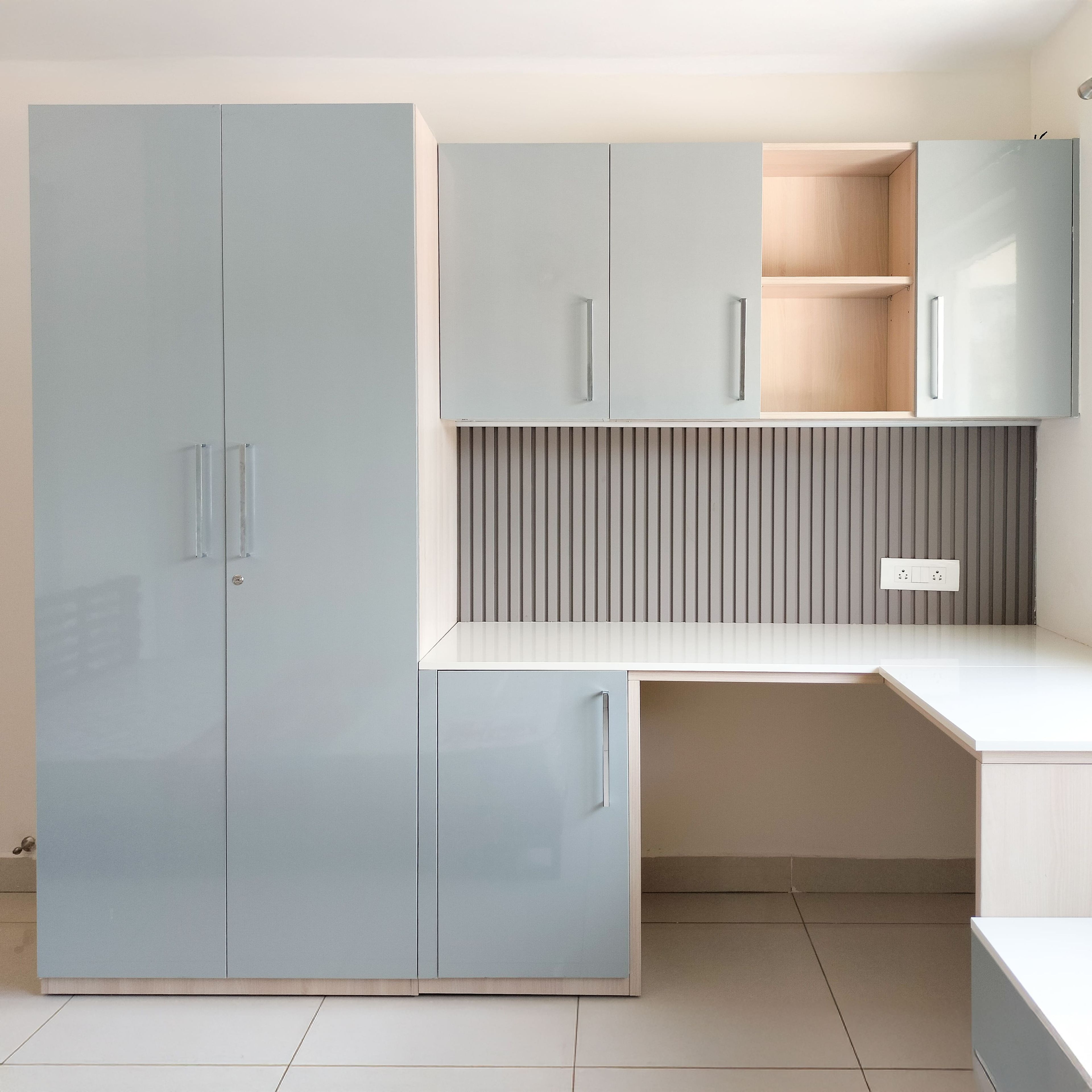 2-Door Powder Blue Swing Wardrobe Design with Attached White Study Desk and Blue Wall Cabinet