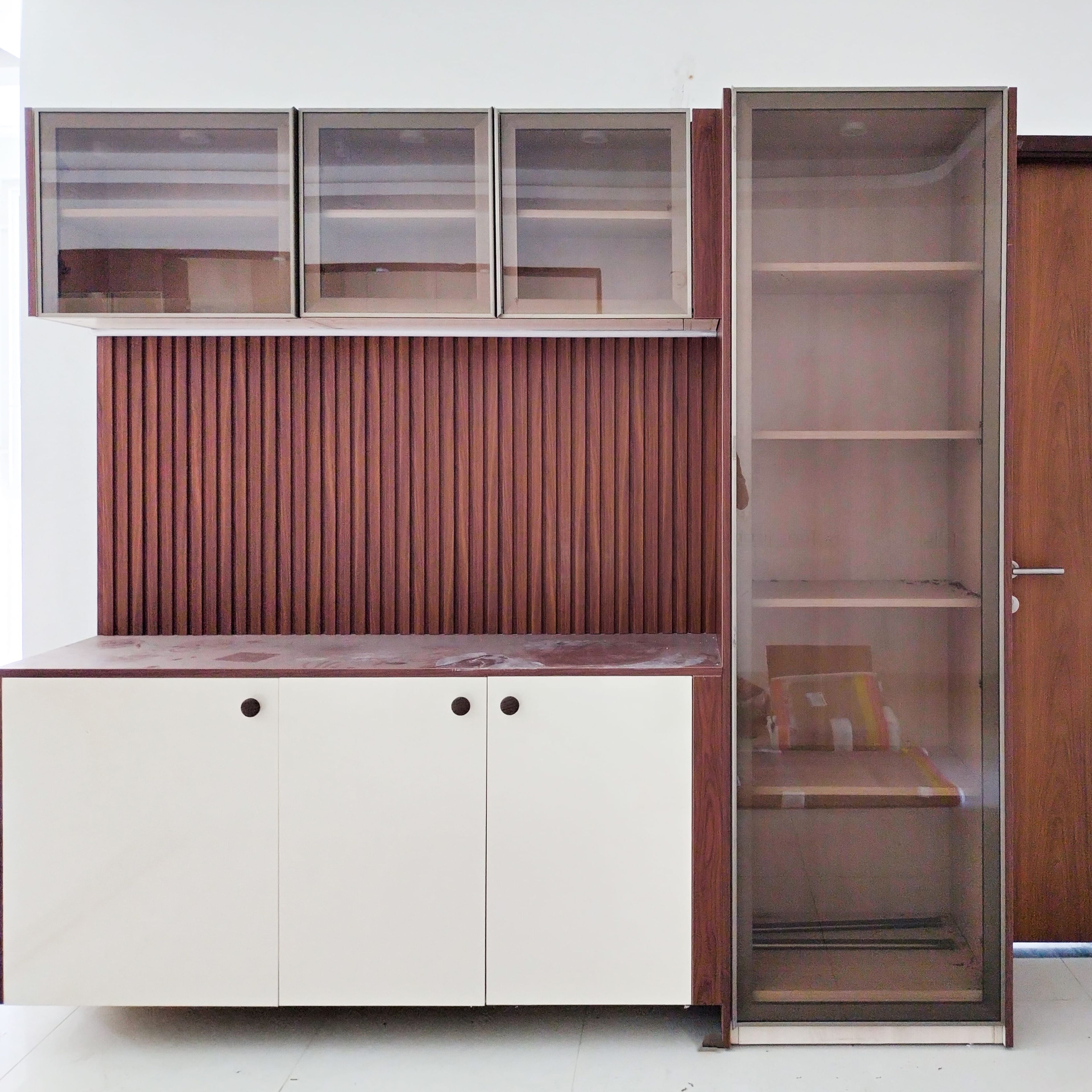 Crockery Unit Design with White Cabinets and Glass Shutter Tall Unit