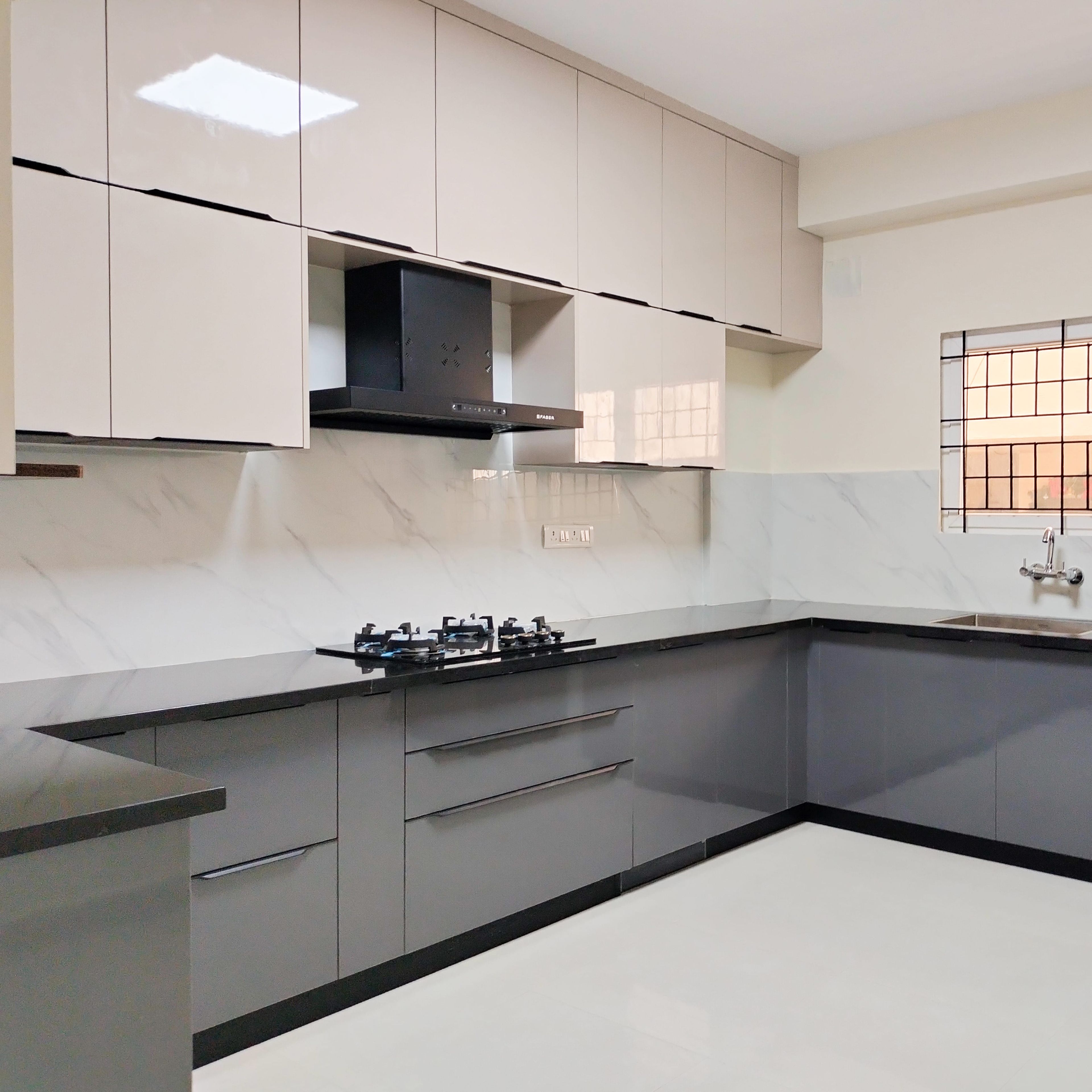 U-Shaped Modular Kitchen Design with Beige and Grey Cabinets and Marble Backsplash