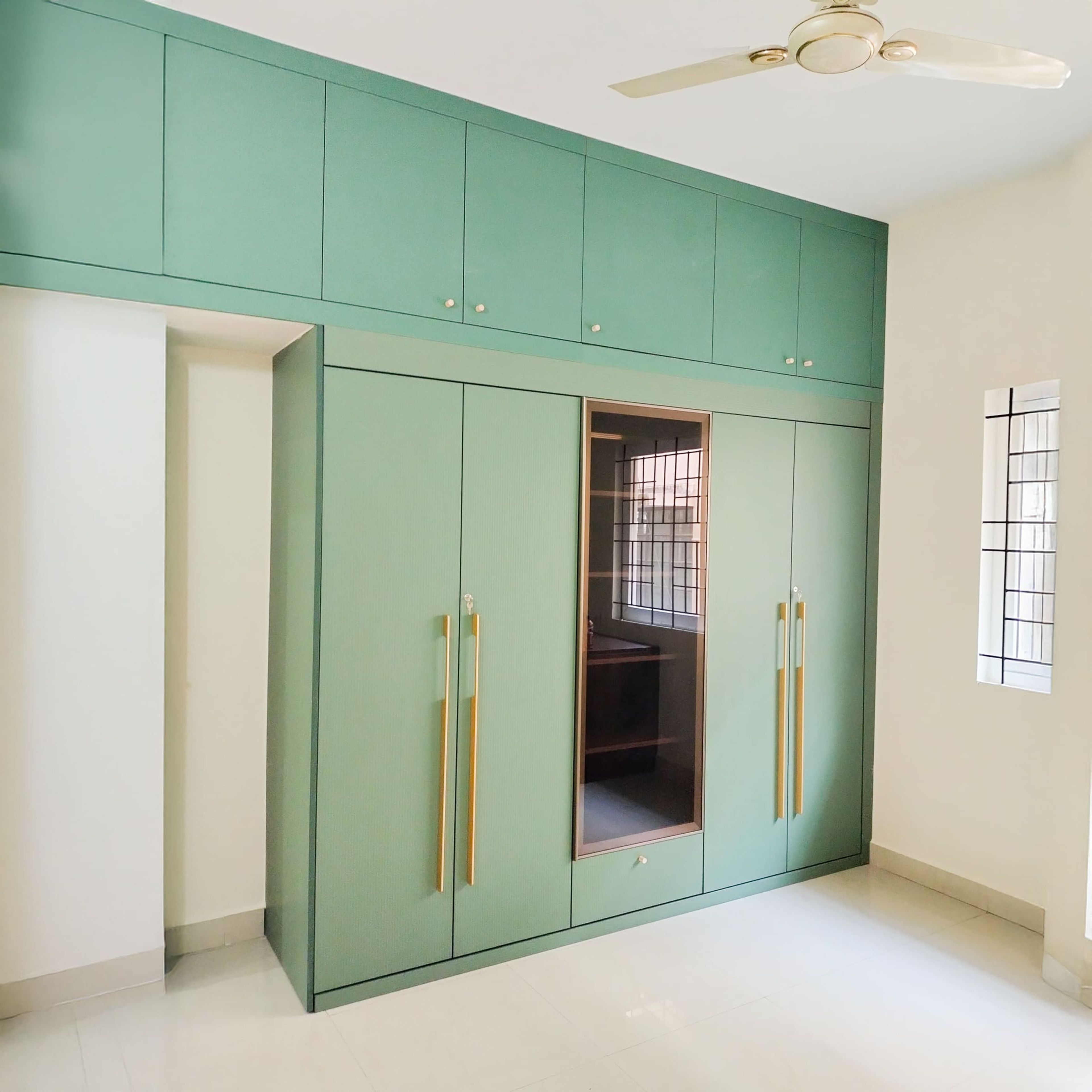 4-Door Green Swing Wardrobe Design with integrated mirror