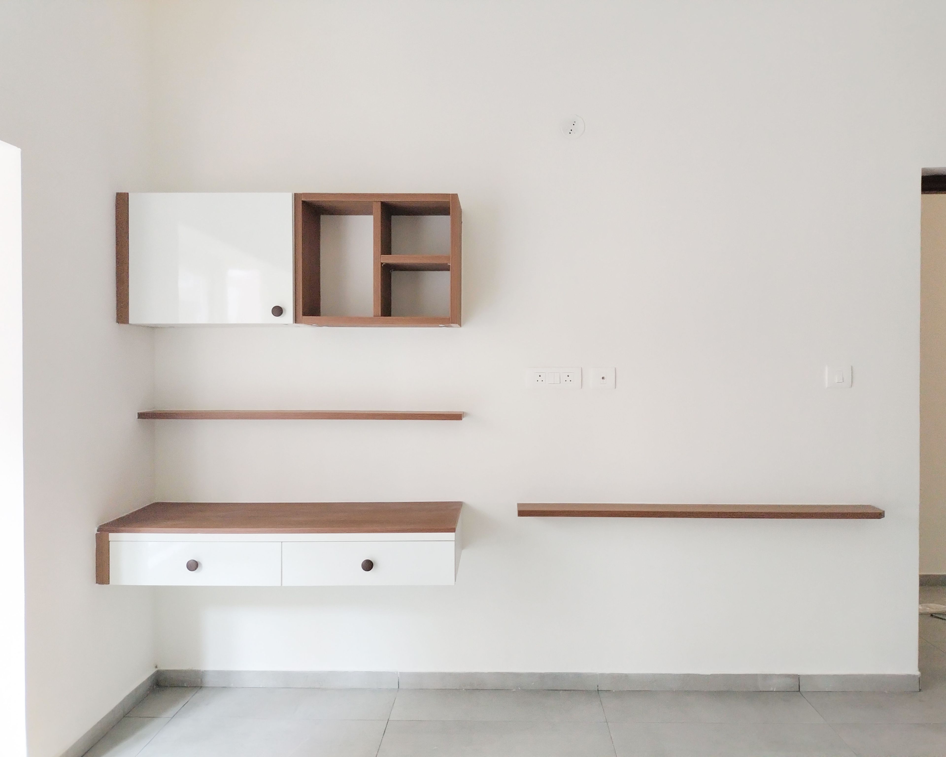White Wall Mounted TV Unit and Study Space with Wall Storage