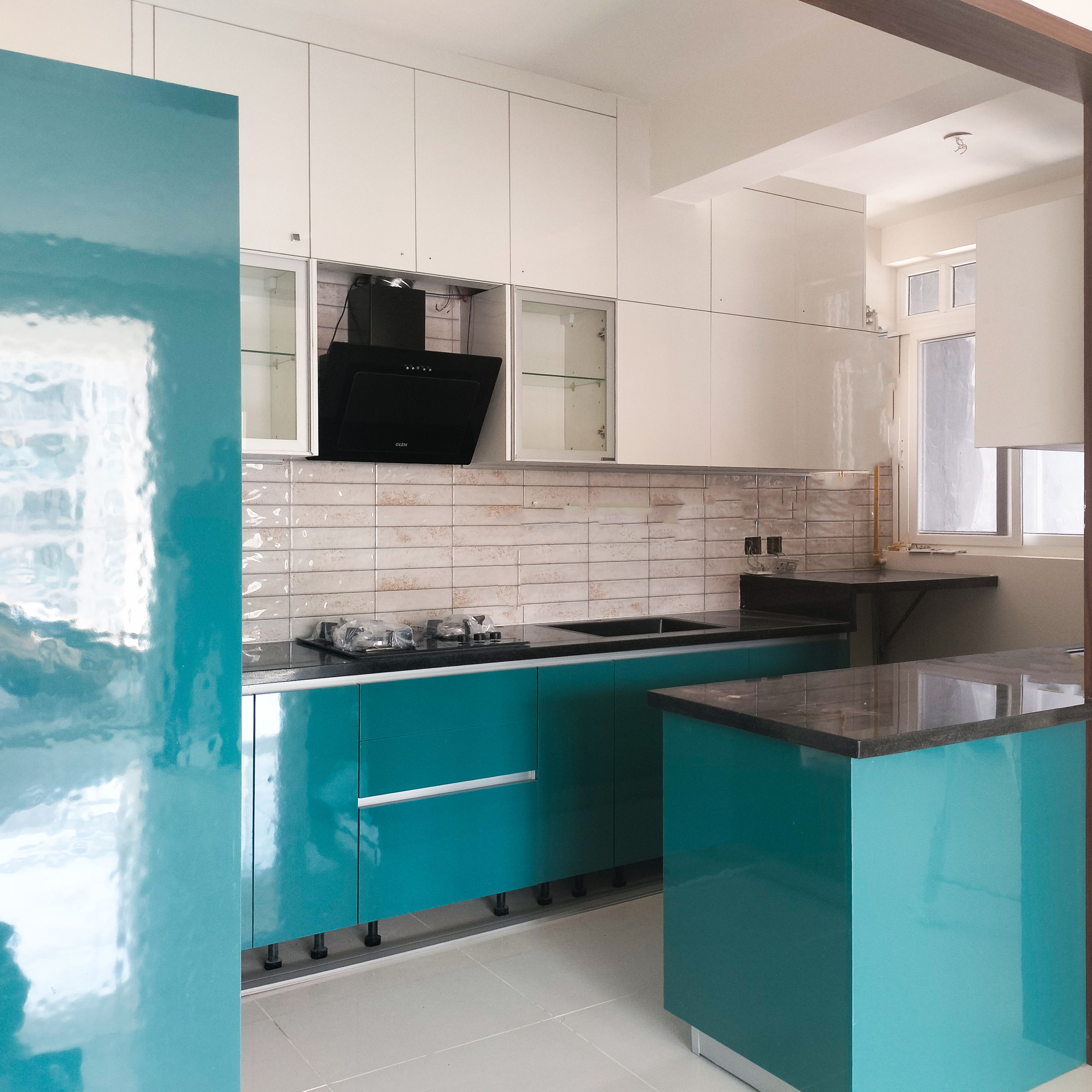 L-Shaped Kitchen Design with Teal Blue Base Units and White Wall Units
