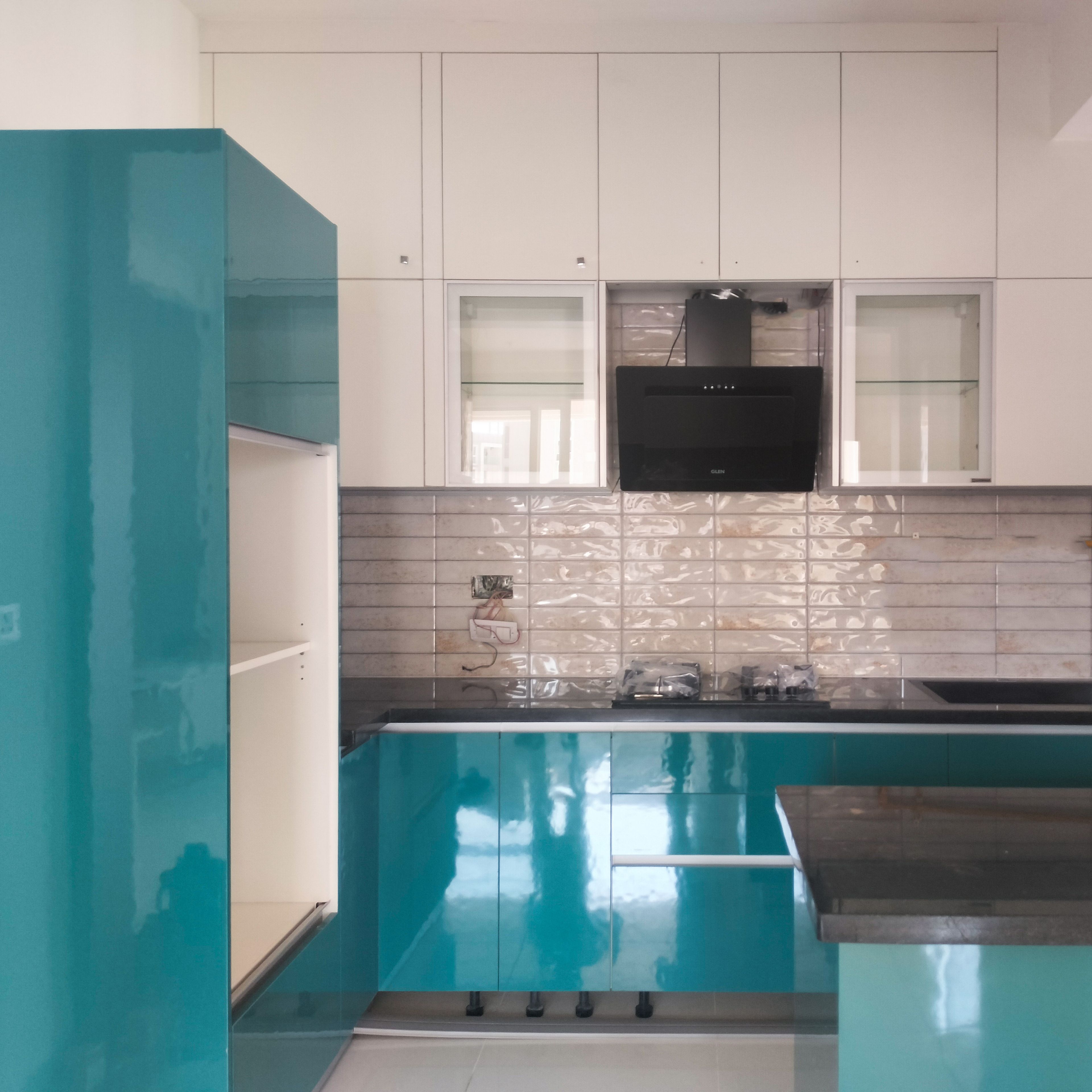 L-Shaped Kitchen Design with Teal Blue Base Units and White Wall Units