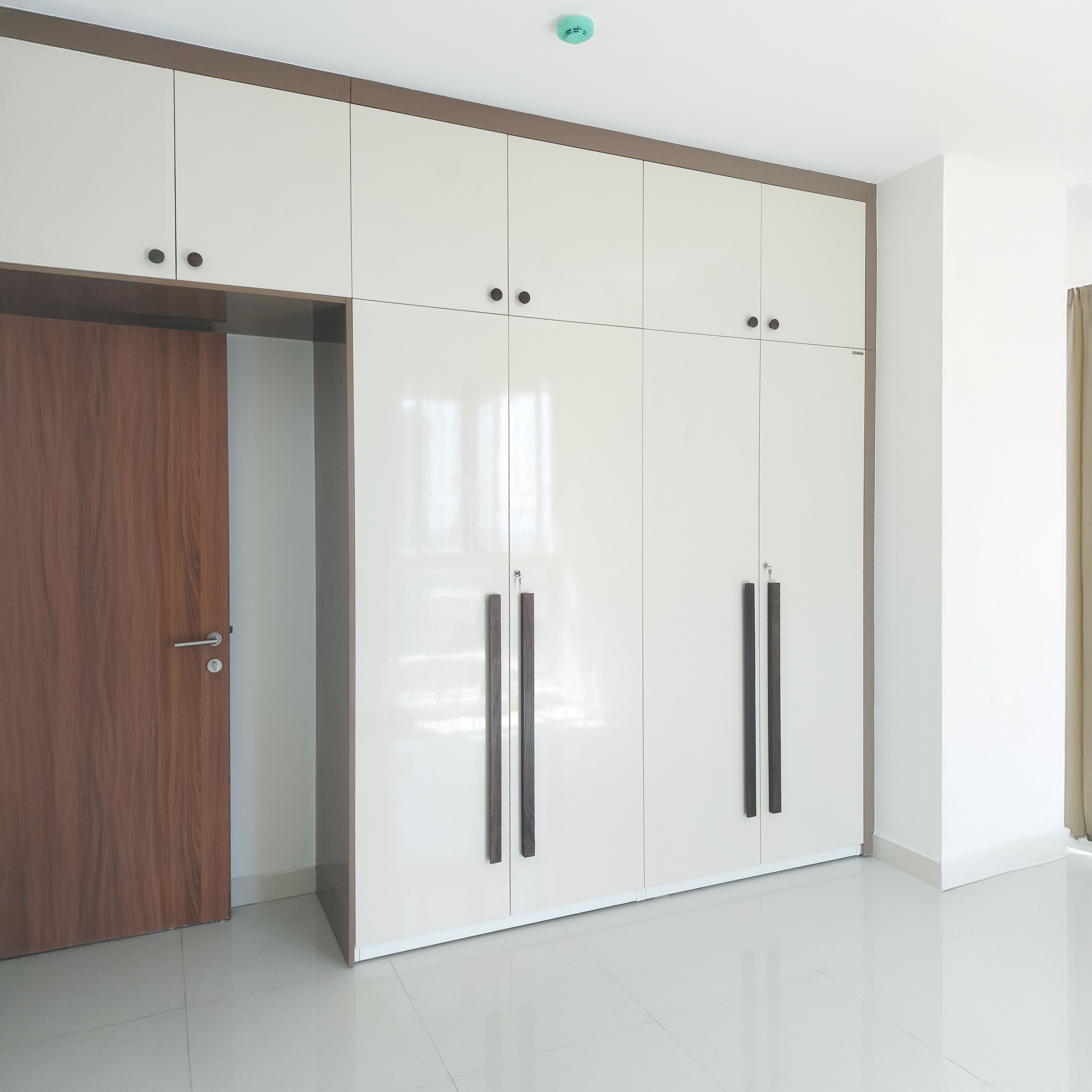 4-Door Glossy Cream Swing Wardrobe Design with Loft Unit